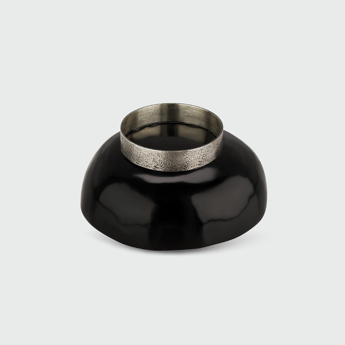 Ossu cup — side angle showing black ceramic and metal rim