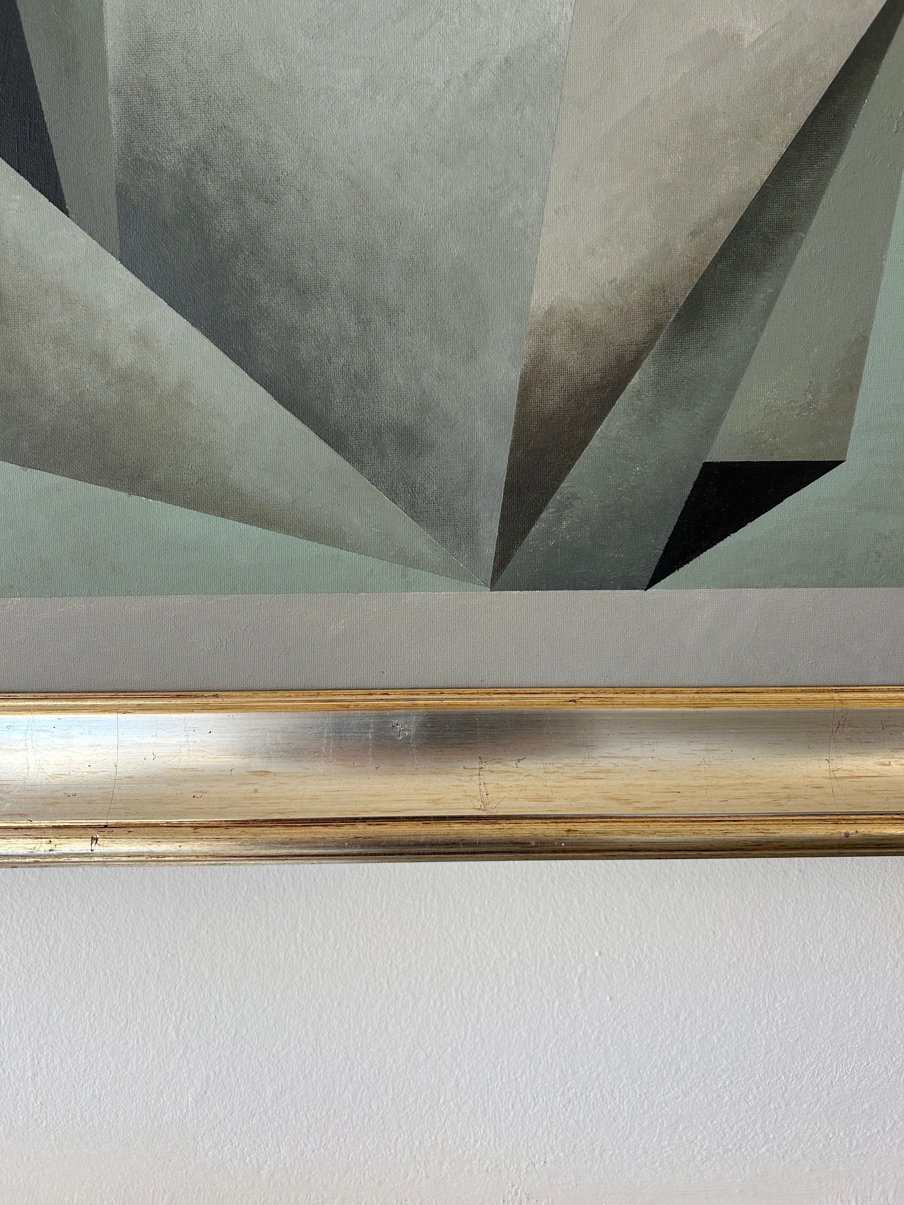 The "Nest" painting by Iris Bavelaar features intersecting gray and black shapes, framed in gold. Displayed on a light wall, it adds contemporary elegance—perfect as modern statement linen wall art for your space.