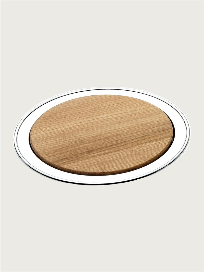 Silver-plated round cutting board by zanetto | The Oblist — wood and silver material