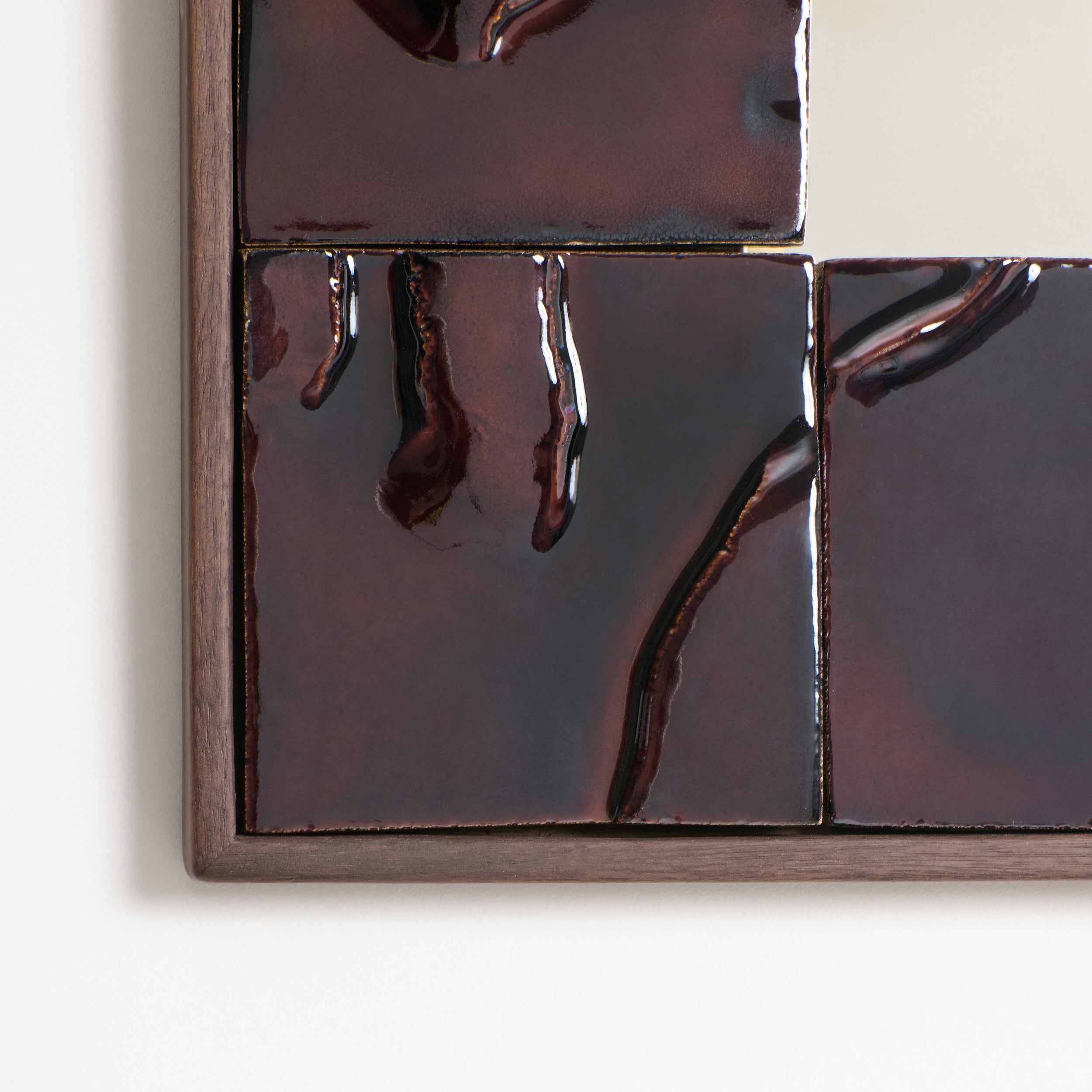 Tiled Mirror — close-up of glossy dark ceramic tiles
