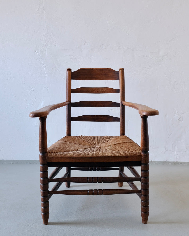 Rustic Bobbin Rush Seat Low Armchair | Netherlands | 1940s — side angle