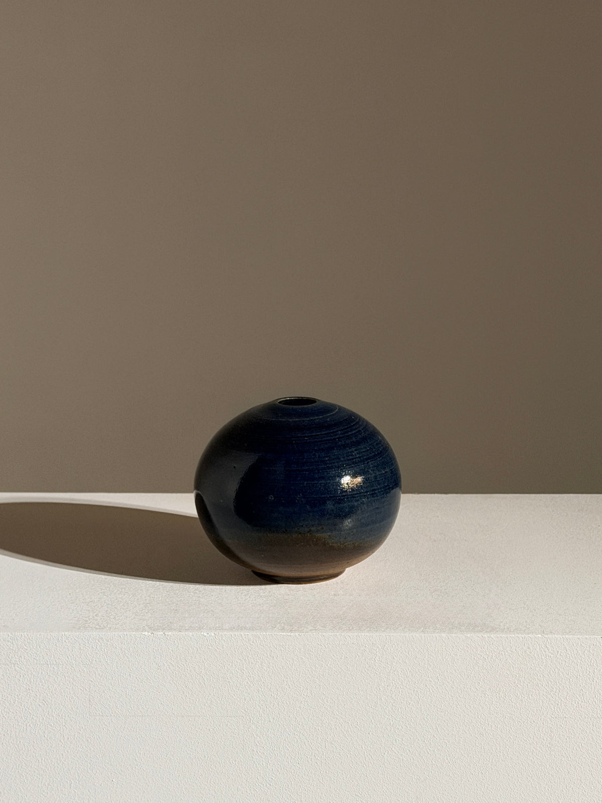 Small round stoneware soliflore vase, France, circa 1960.  — lifestyle setting