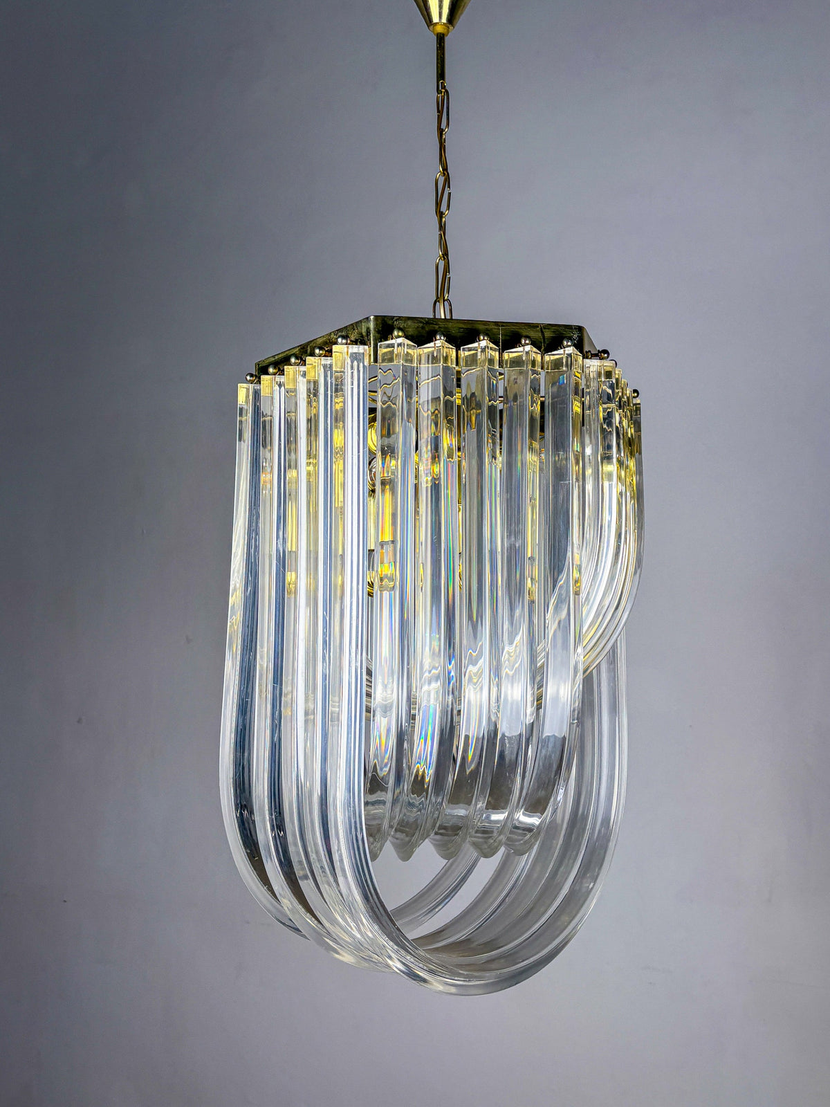 Long Mid-Century Curved Lucite Ribbon Chandelier in Brass, Italy — lifestyle setting