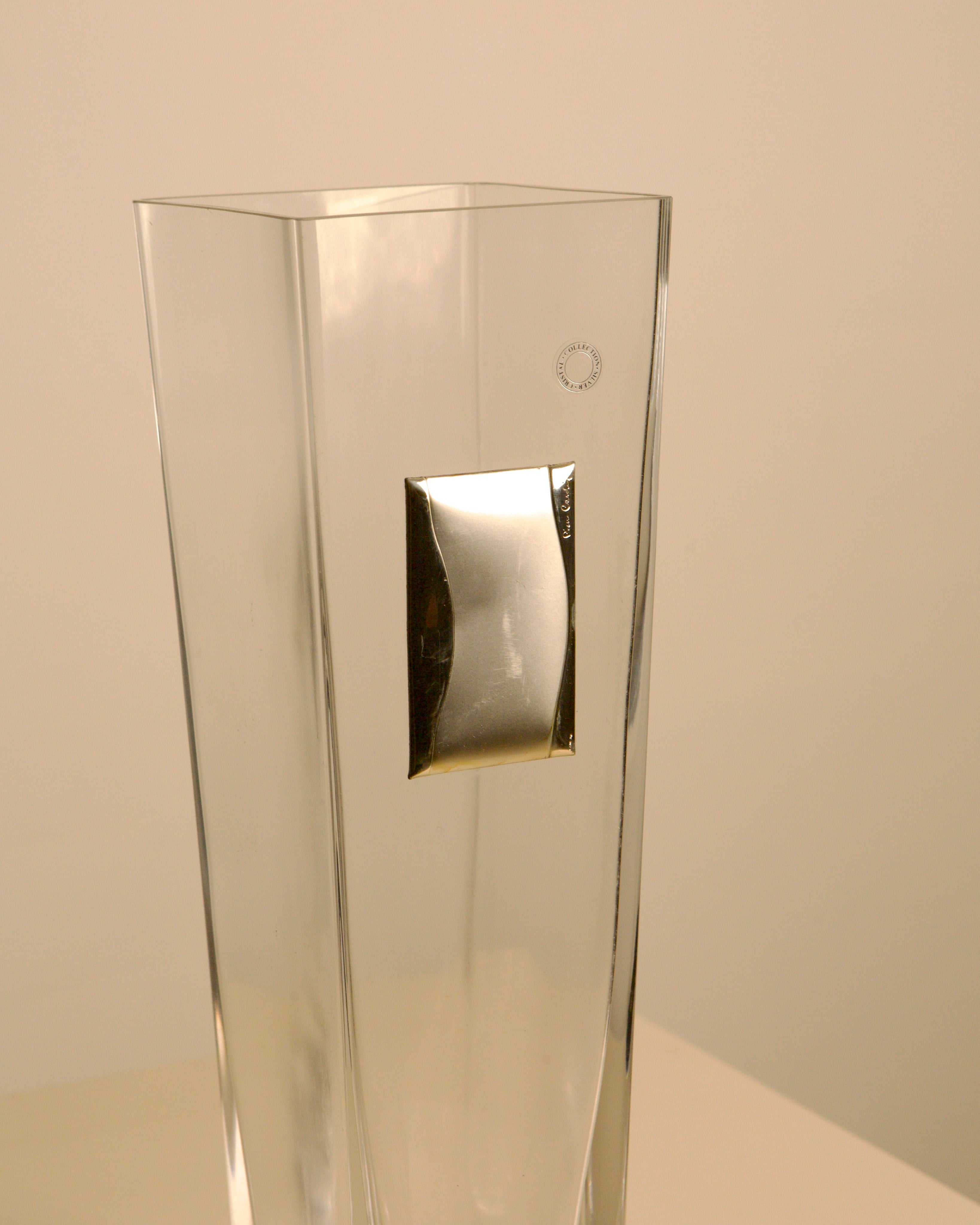Glass vase with metal details by Pierre Cardin, 1980s — close-up of clear glass with silver accent