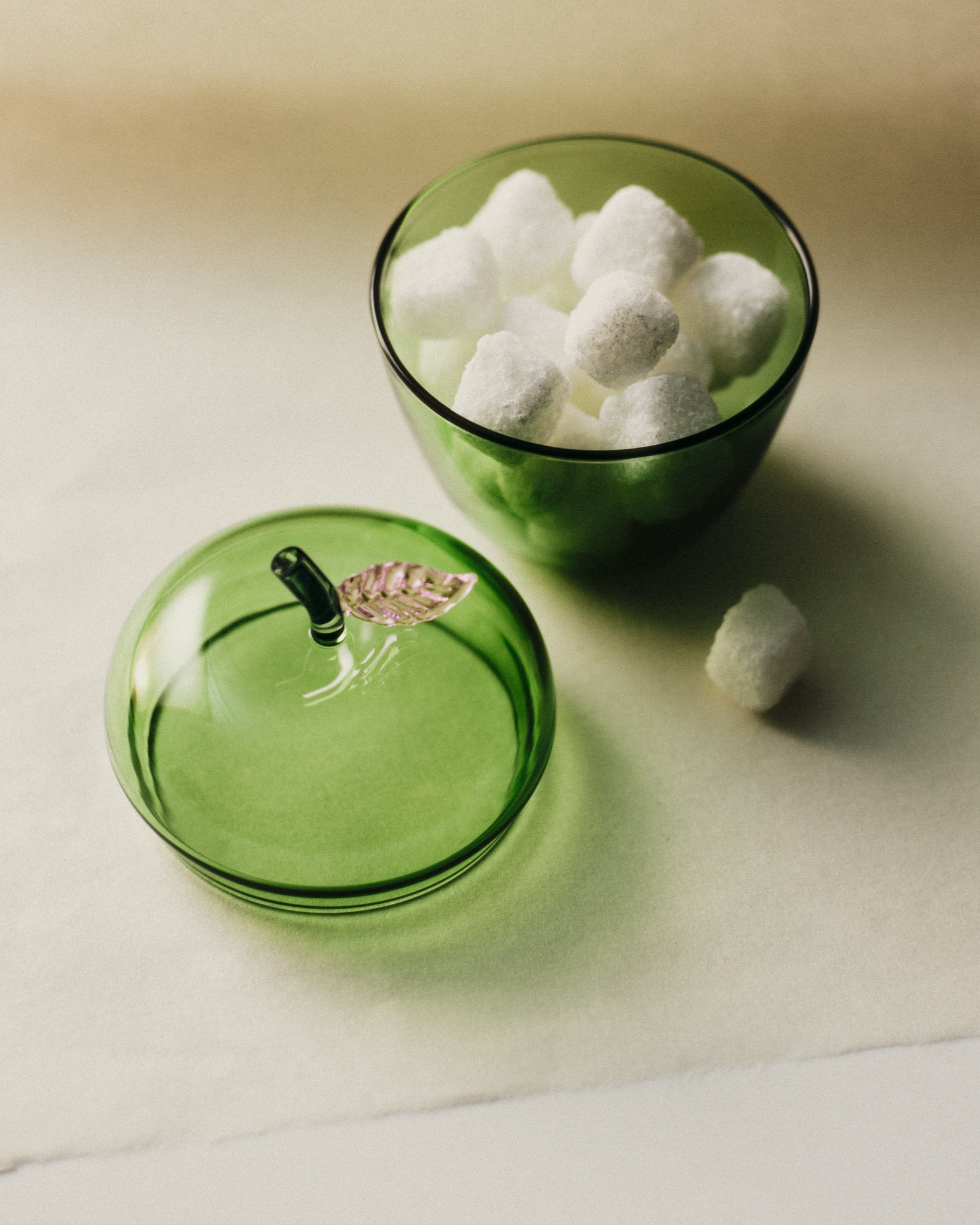 La Pomme — top view of green glass container with sugar cubes