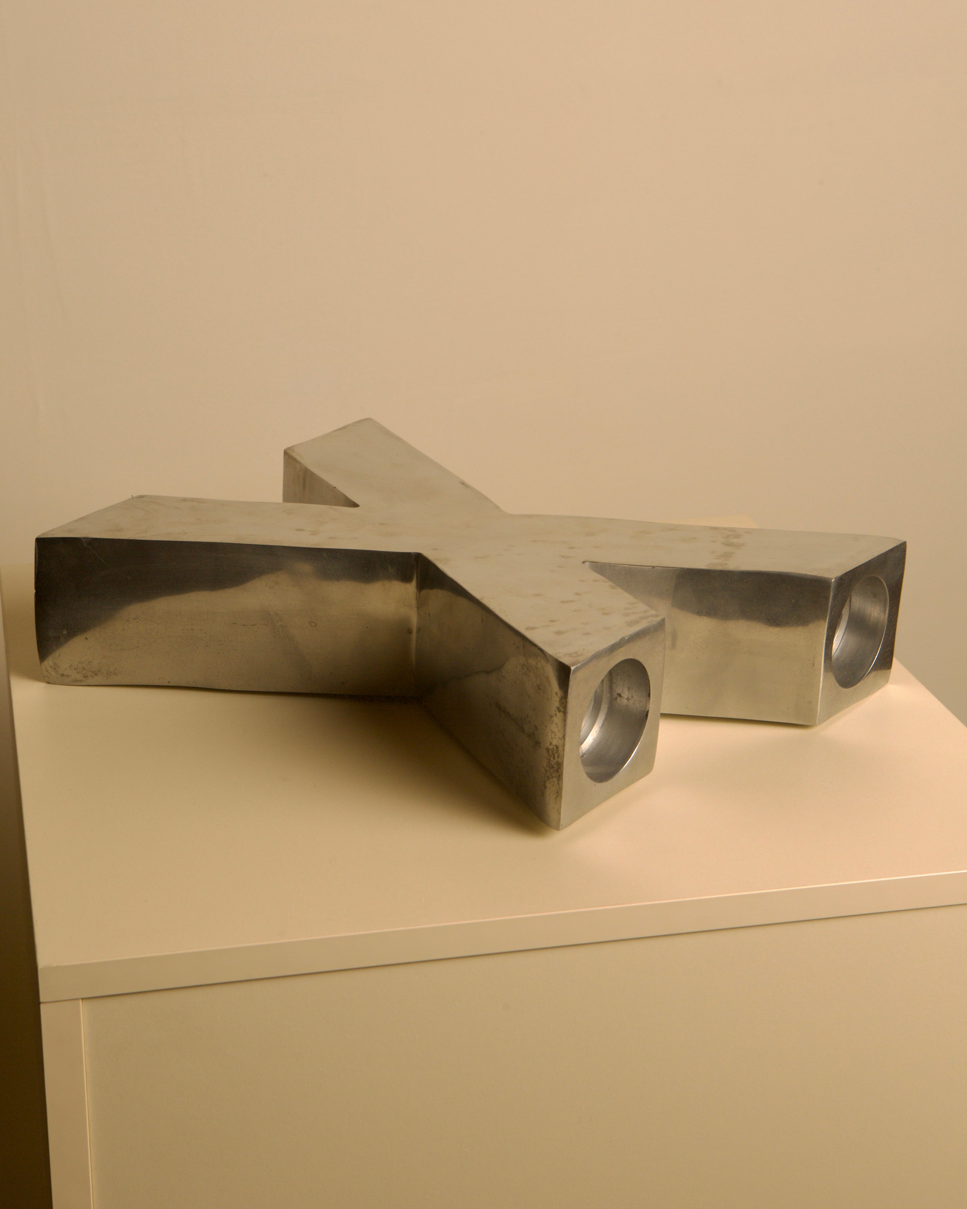 Large "X" Candleholder in Cast Aluminum 80's — angled view on light-colored surface