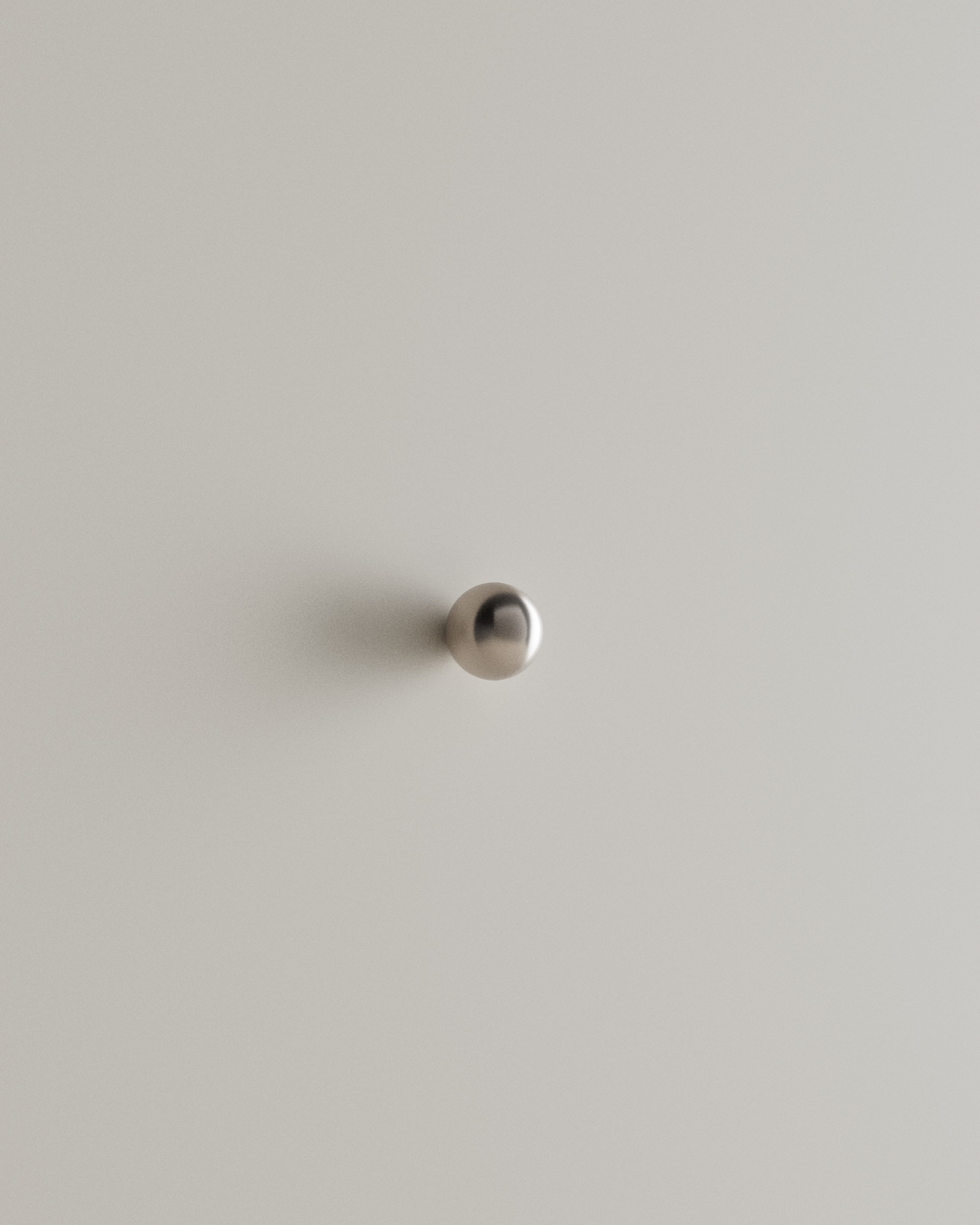 CERCLE Cabinet Knob Small — top view of polished metal knob