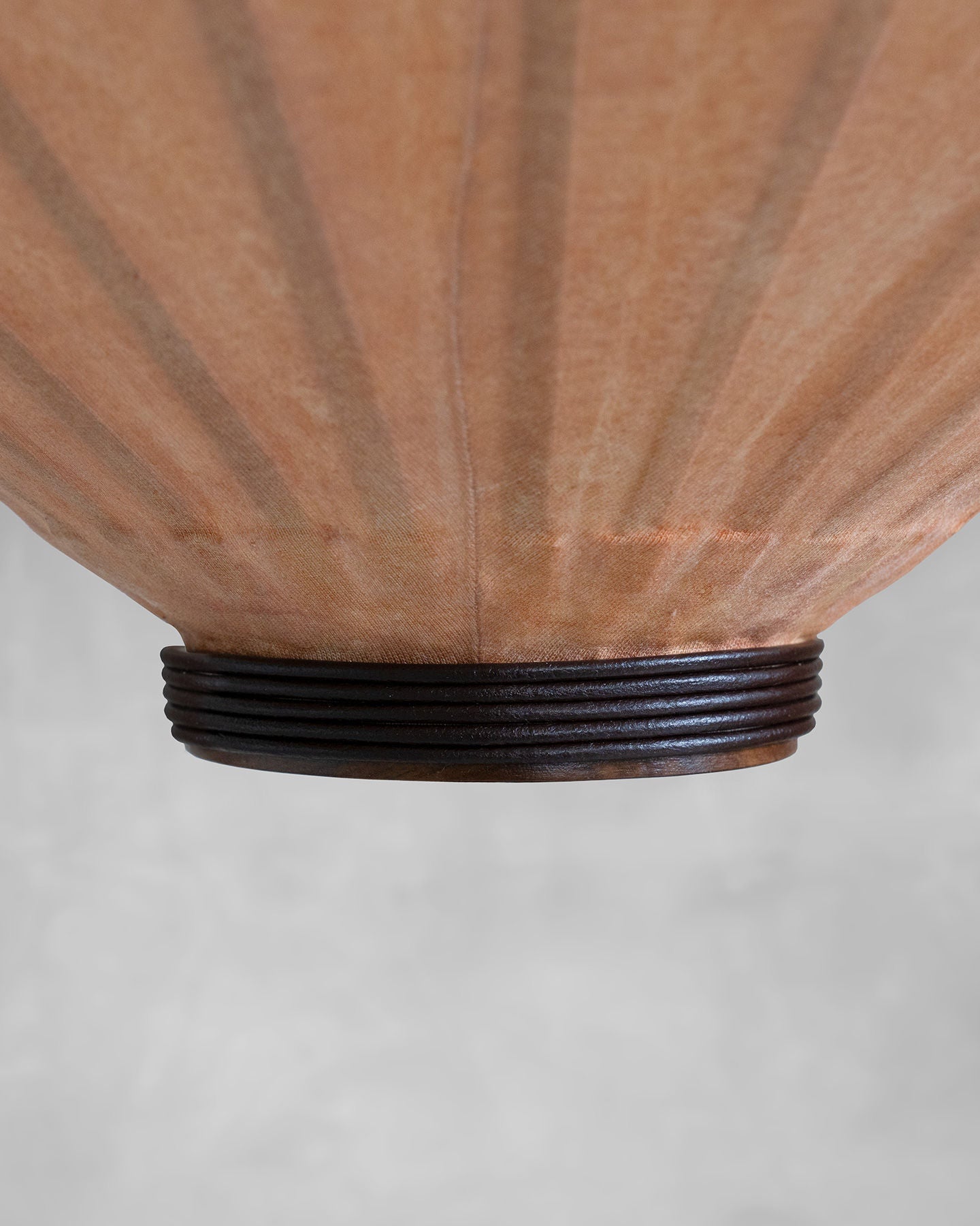 Tu, tuolo shape — top view of paper shade with wooden base
