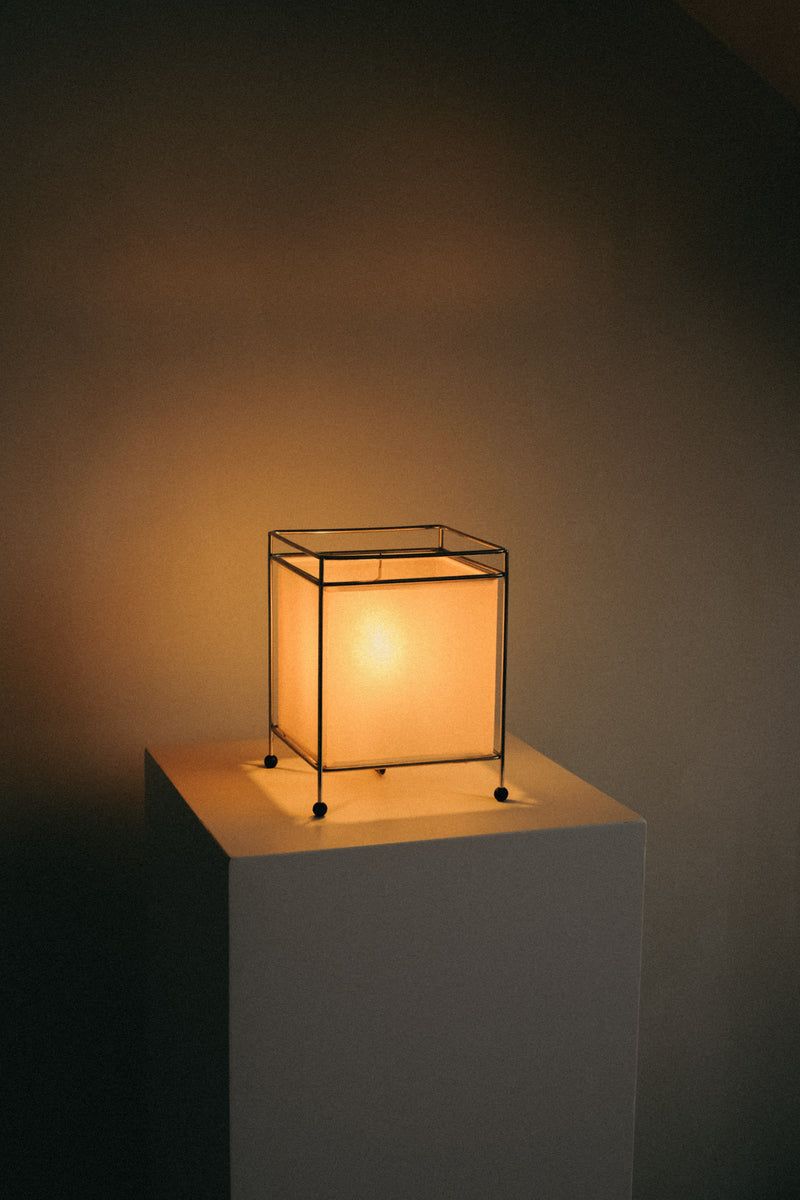 Japanese Rice Paper Table Lamp — close-up of soft glow on white pedestal