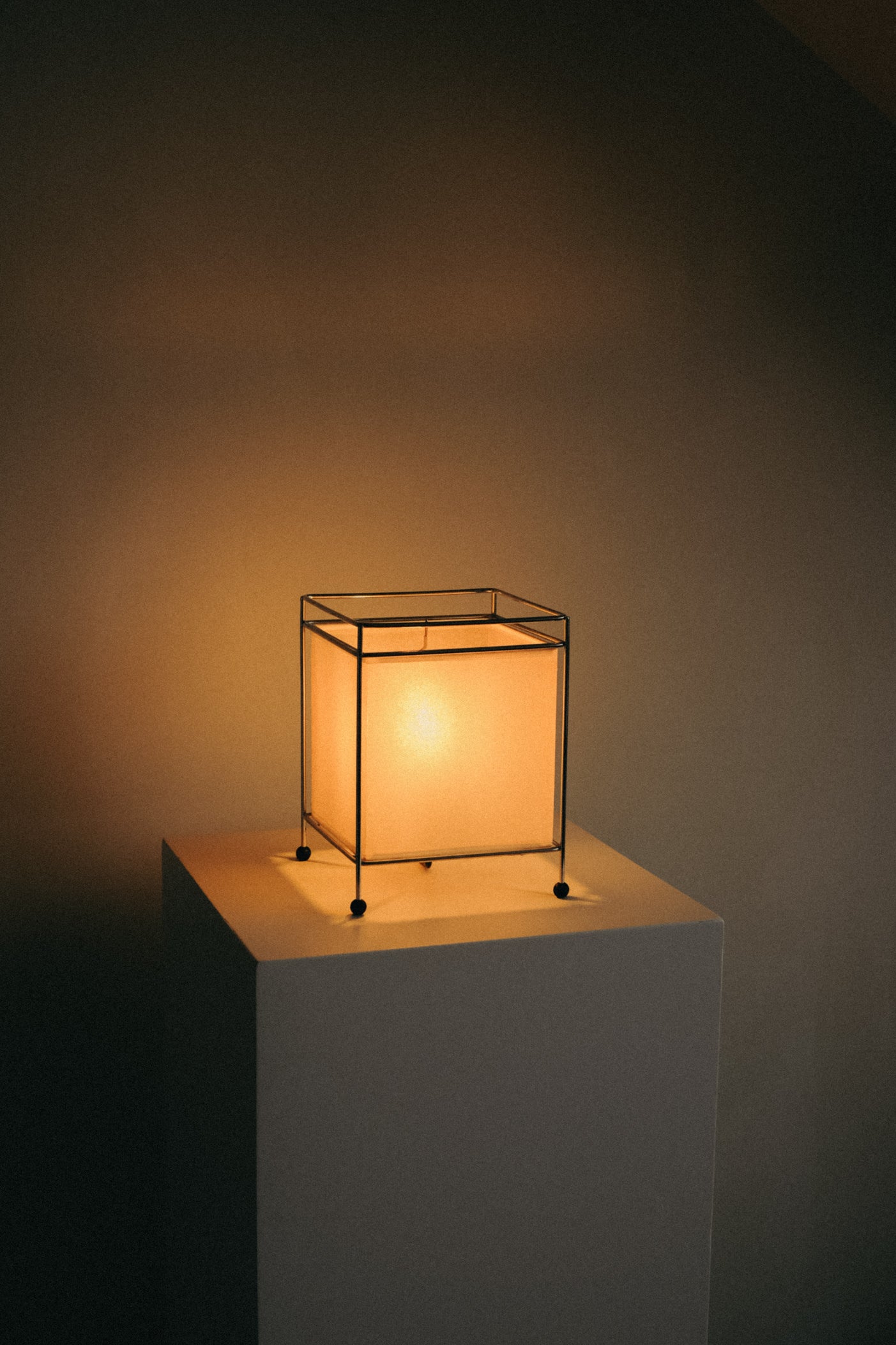 Japanese Rice Paper Table Lamp — close-up of soft glow on white pedestal