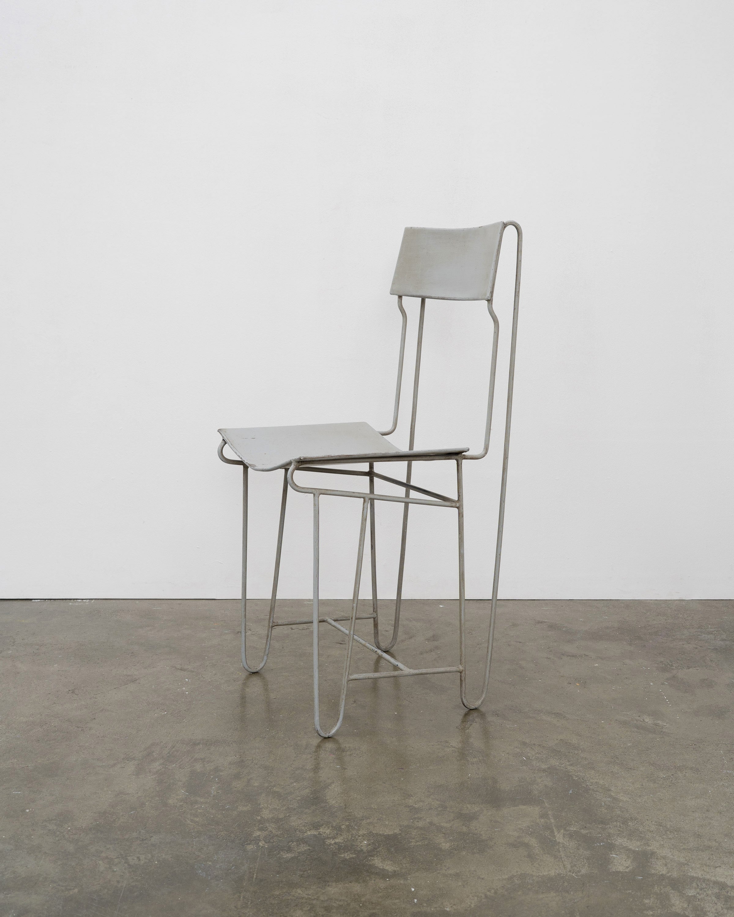 Modernist Steel Chair — side view on concrete floor