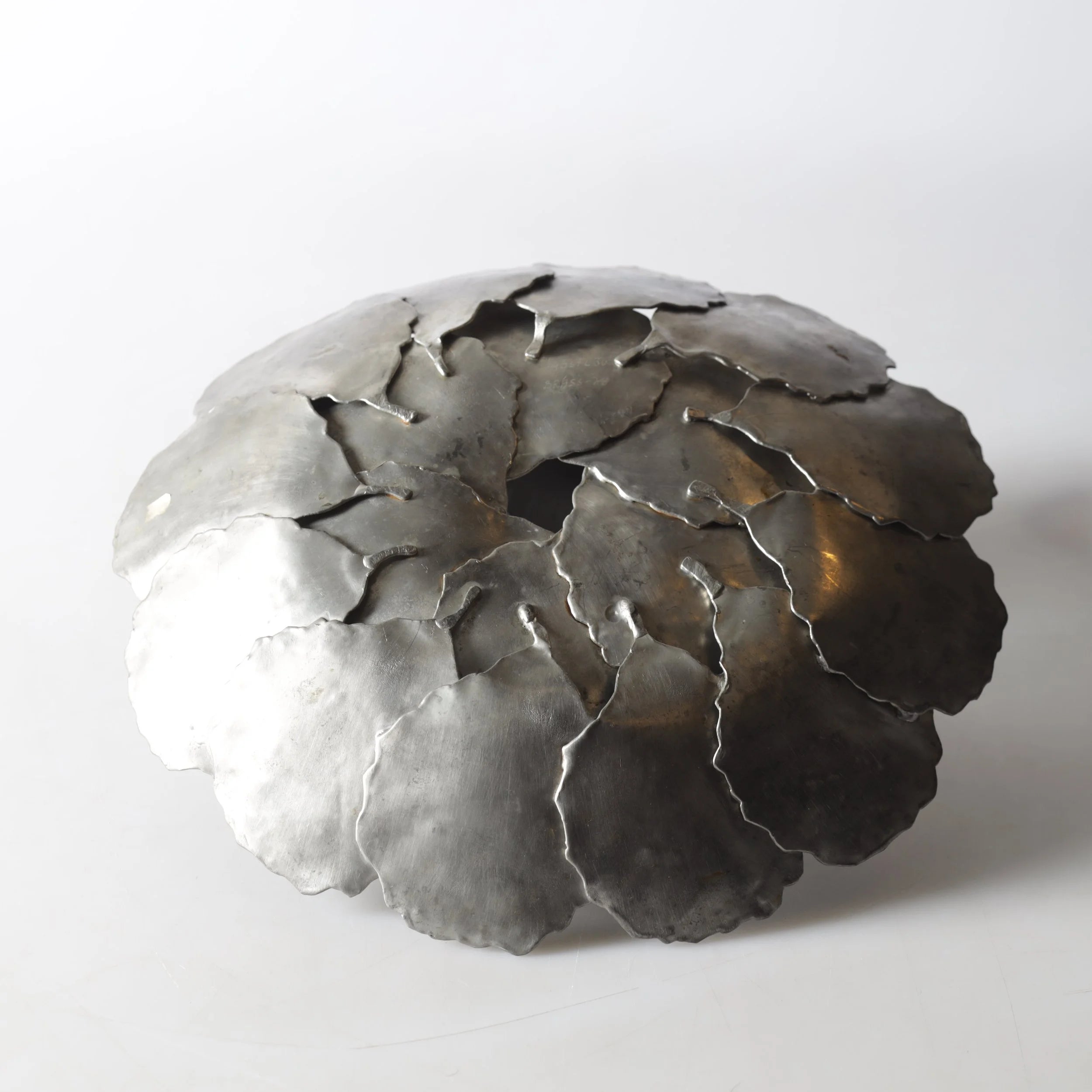 A large decorative 'Höstlöv' pewter dish, (1973) — lifestyle setting