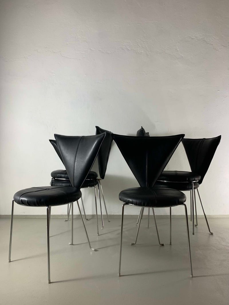 Six black leather Lubke chairs with chrome legs, back view detail