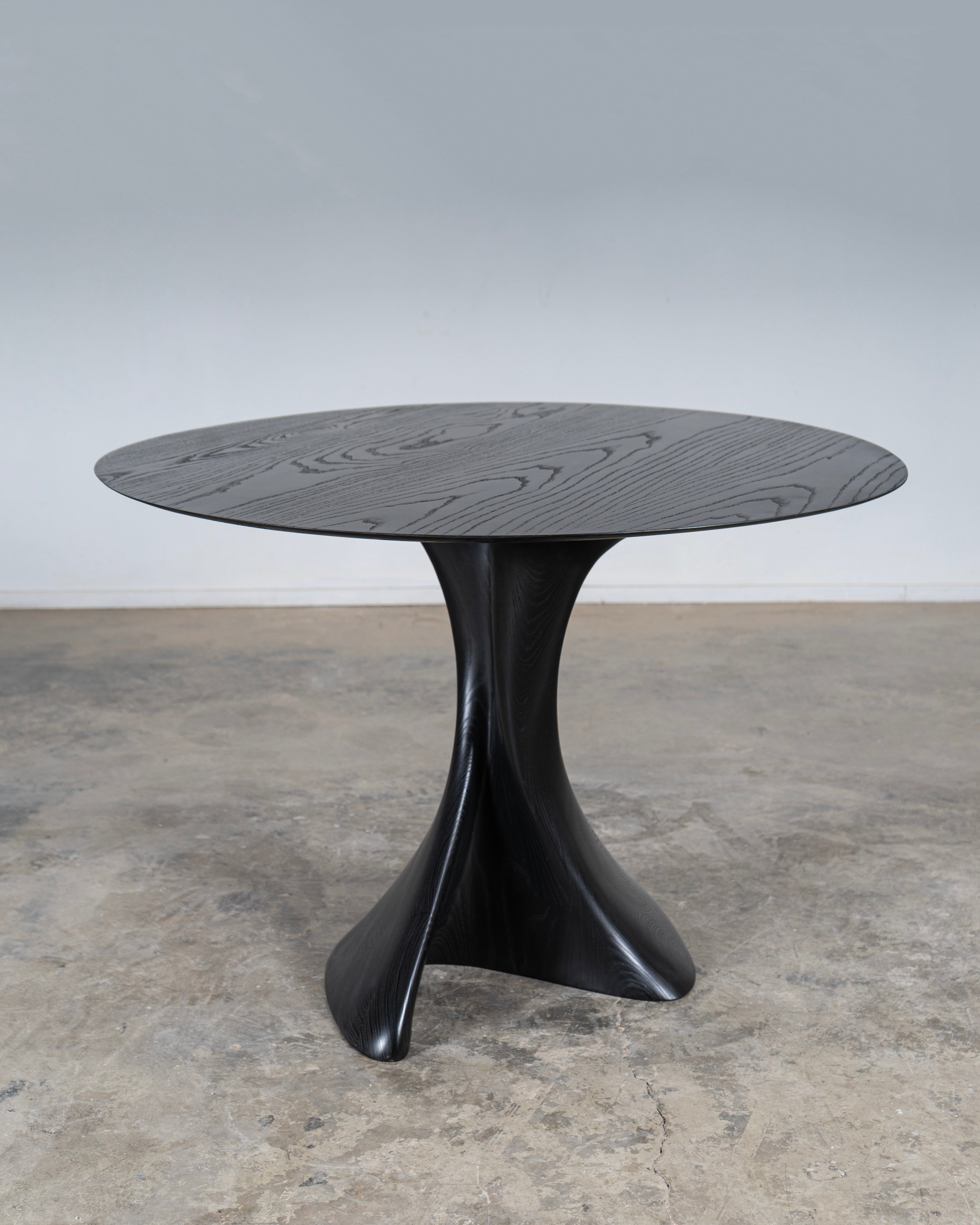 Sculptural Dervish Table in Ash wood Ebony stain — close-up