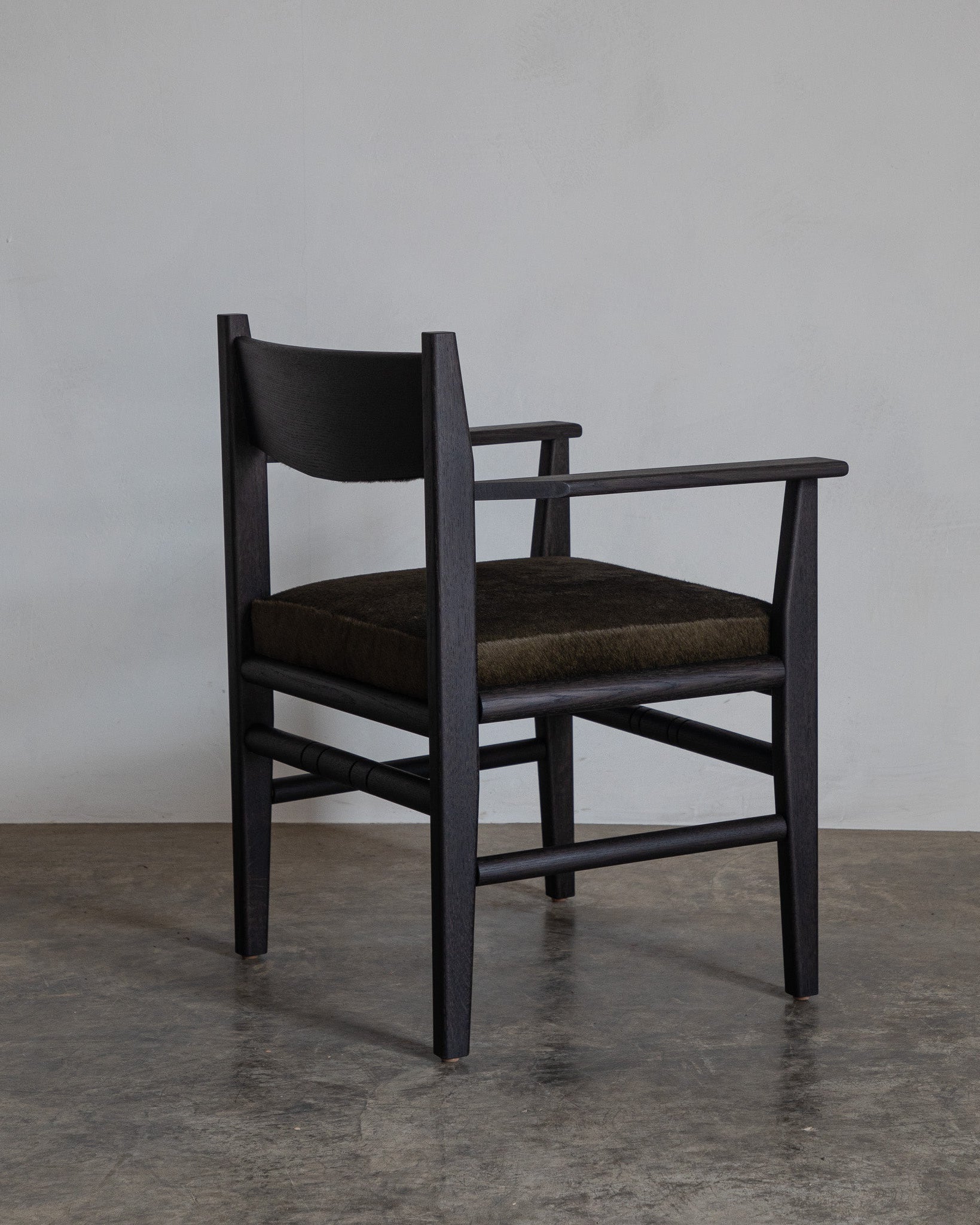 Silo Upholstered Chair — angled view showing dark wood frame and fabric seat