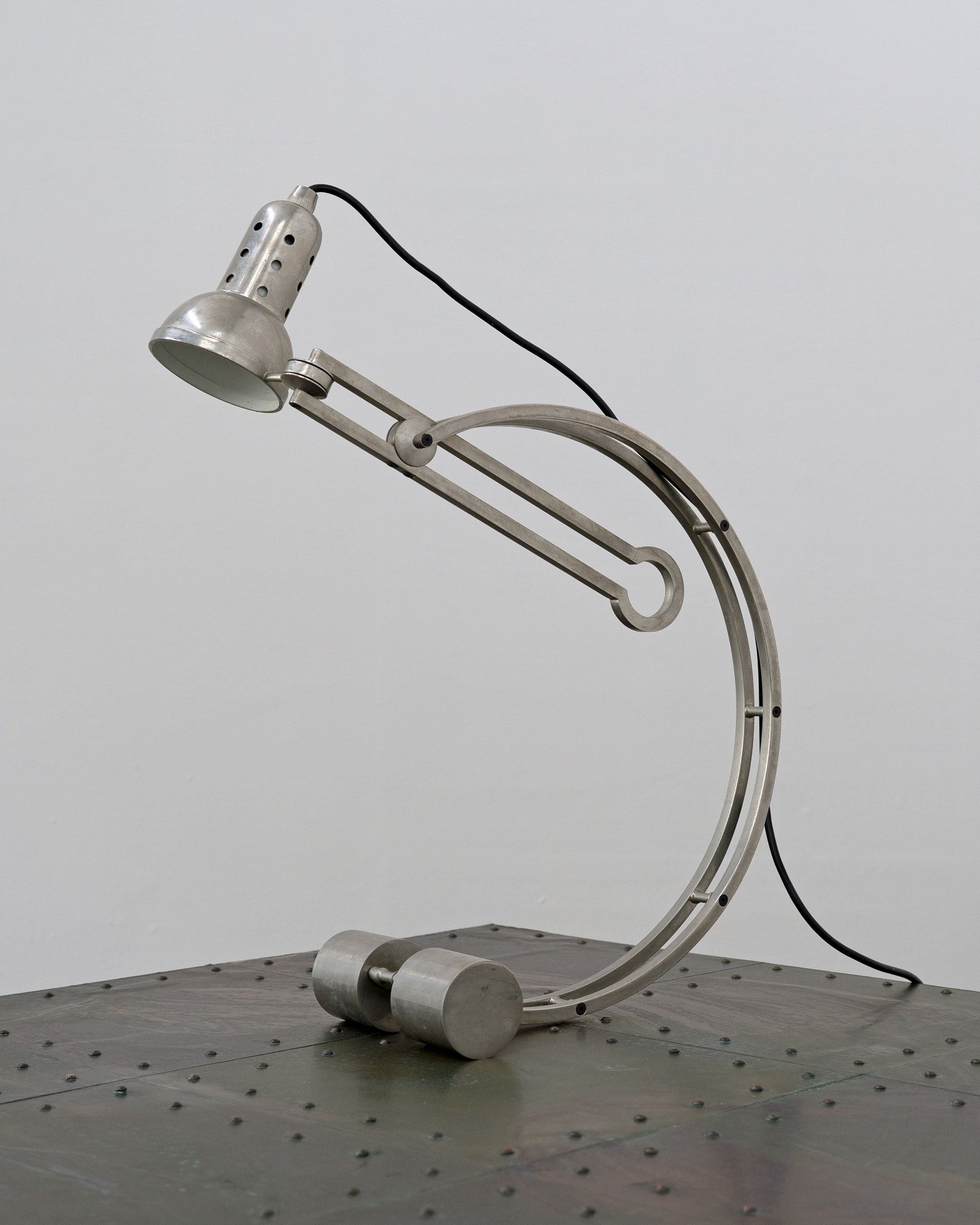 Curved chrome Art Deco table lamp with adjustable arm detail