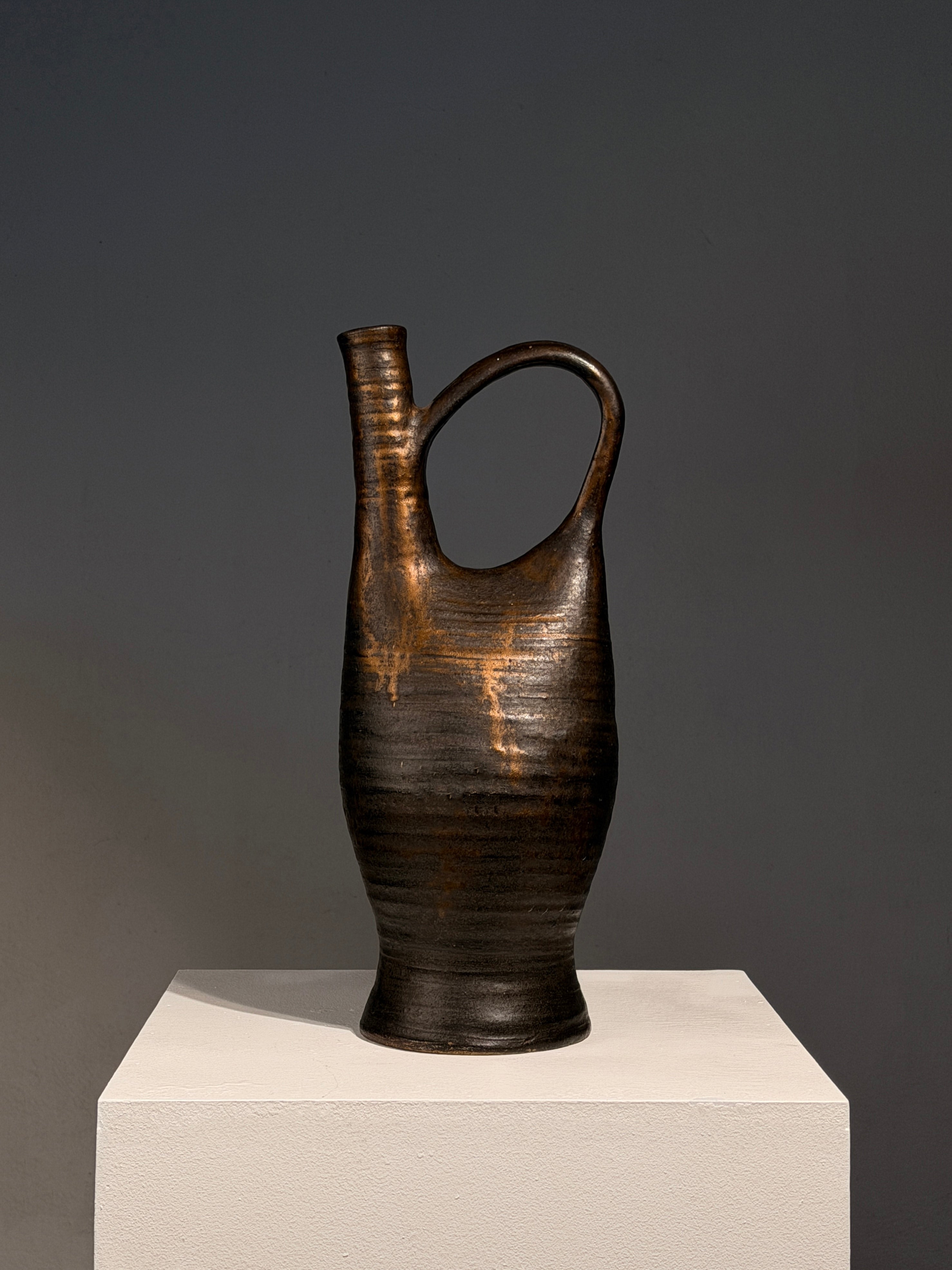 Large Stoneware Pitcher by Bernadette Sulmont, France, circa 1960 — angled view on white pedestal