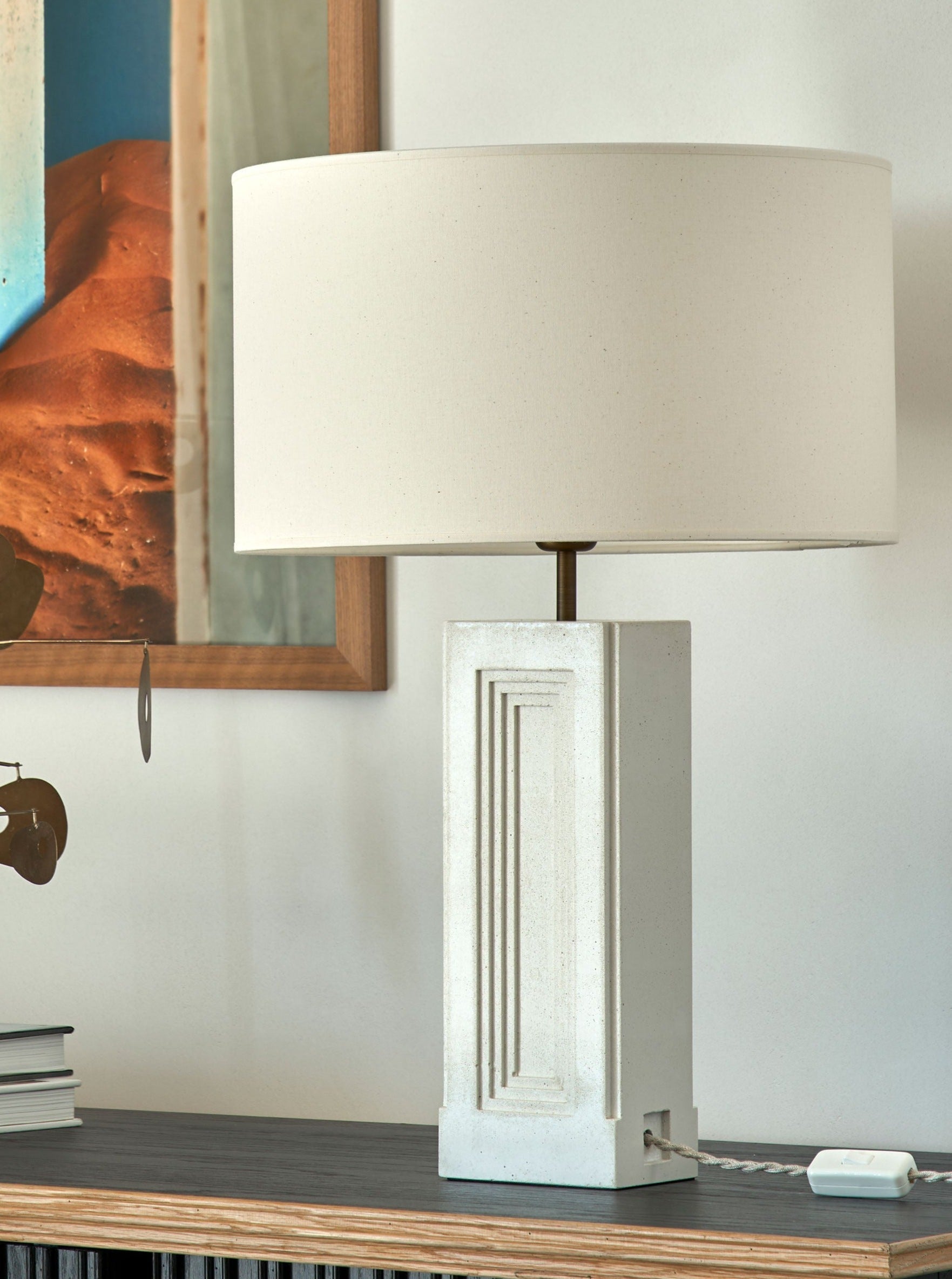 Nini Lamp — white concrete base on wooden side table