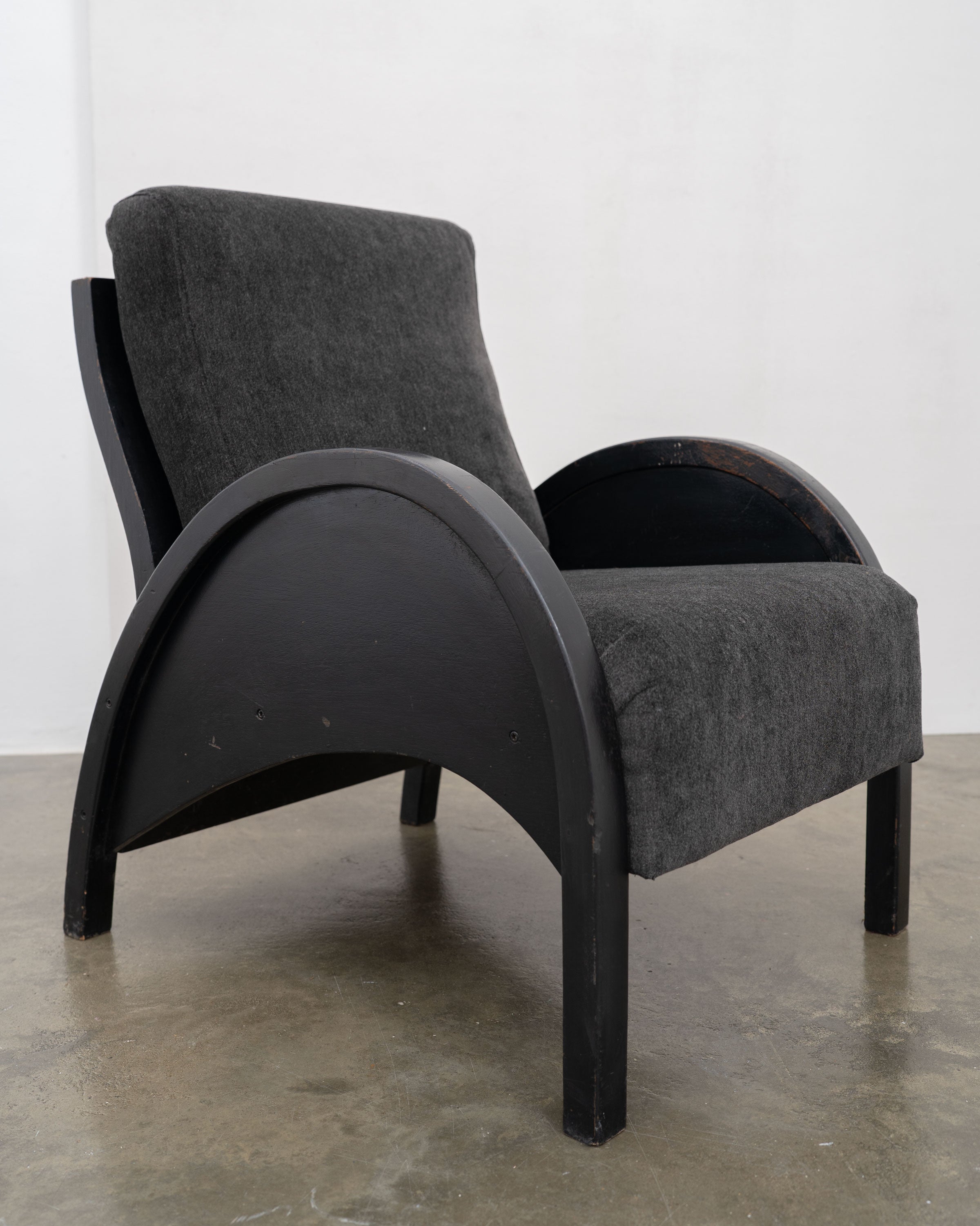 Modernist Armchairs, c.1950 — angled view of black upholstered armchair