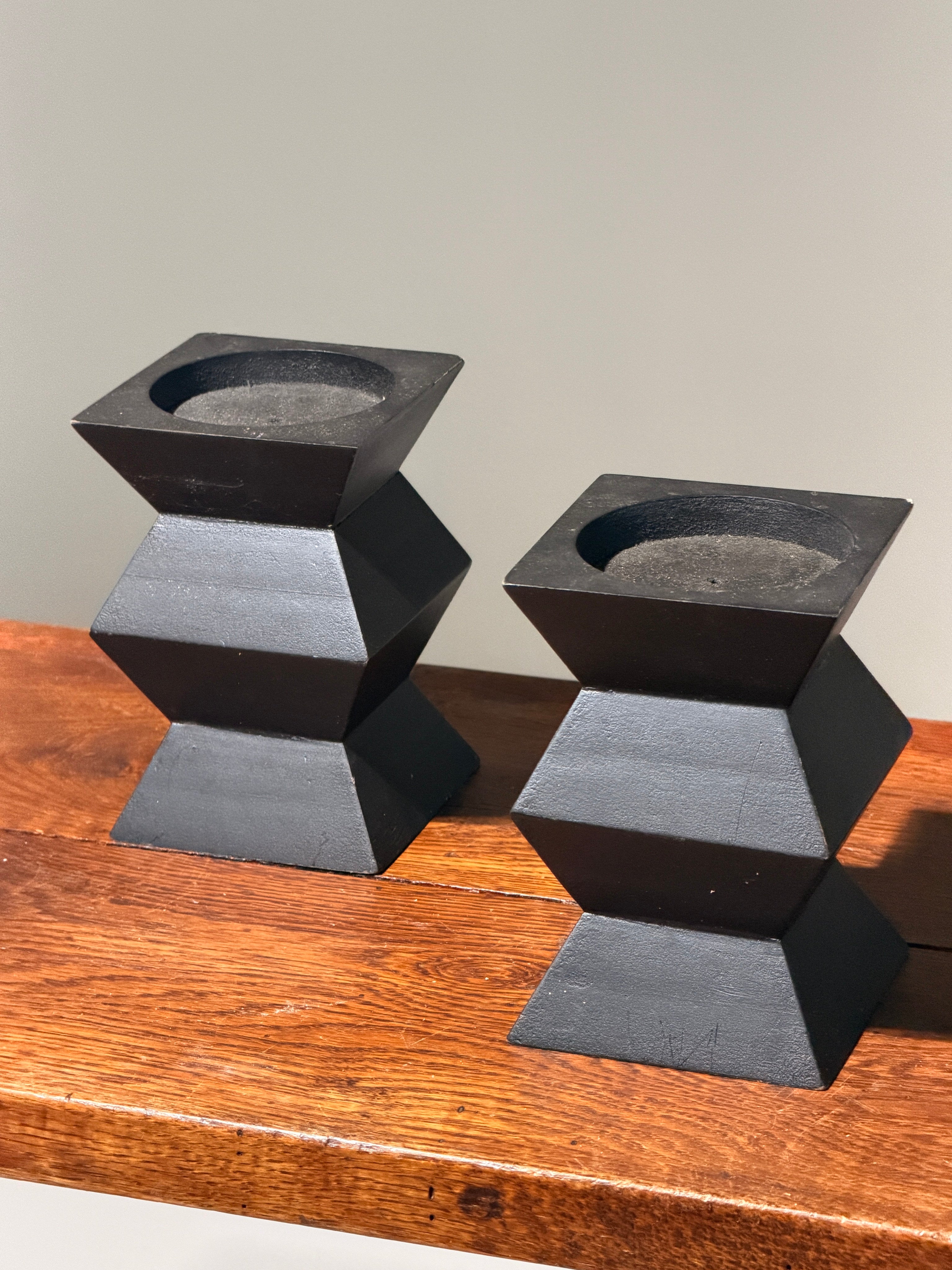 Pair of geometric black wooden candlesticks, anonymous work — side angle