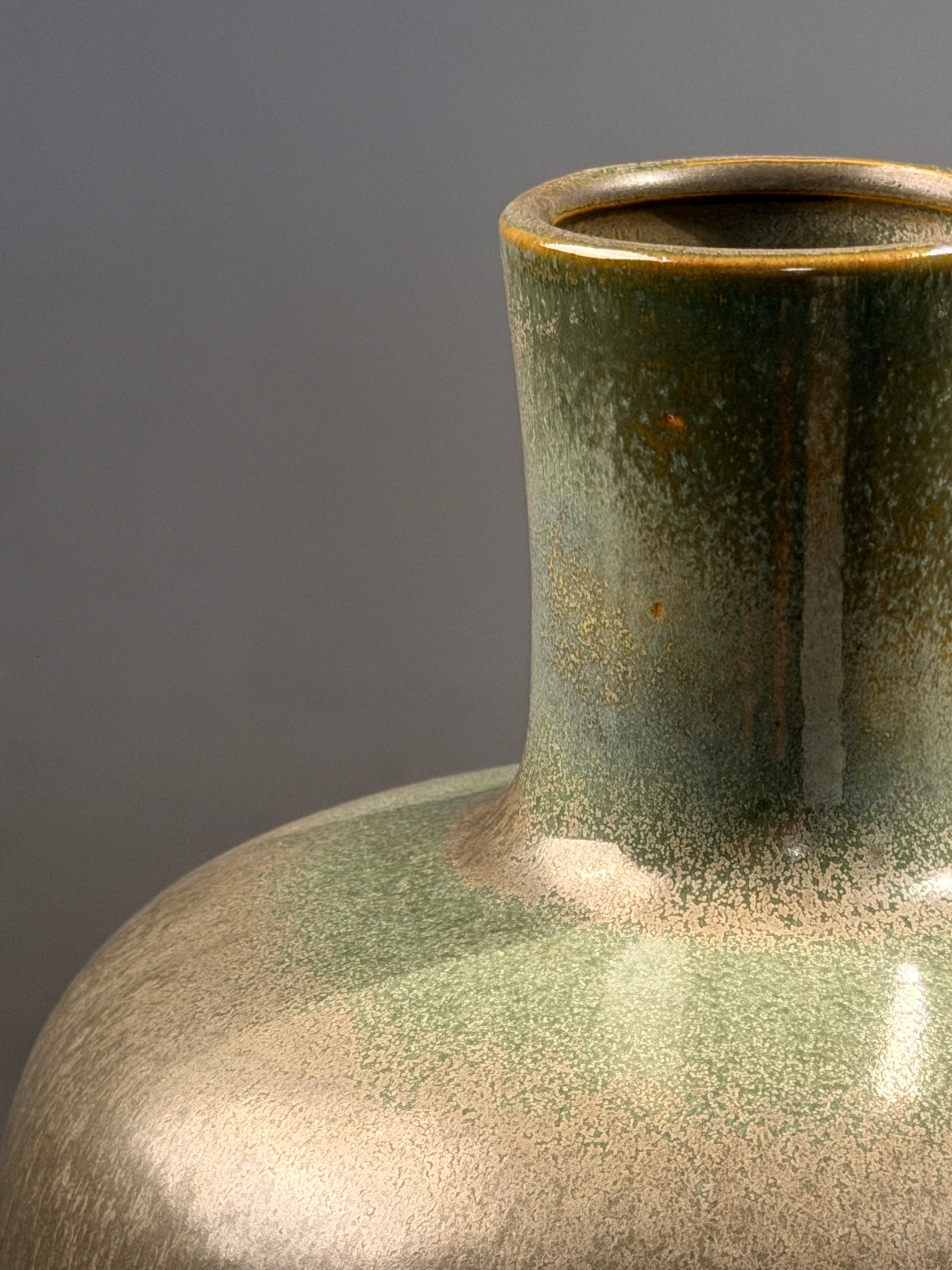 Speckled green glazed earthenware bottle vase, circa 1970 — detail view