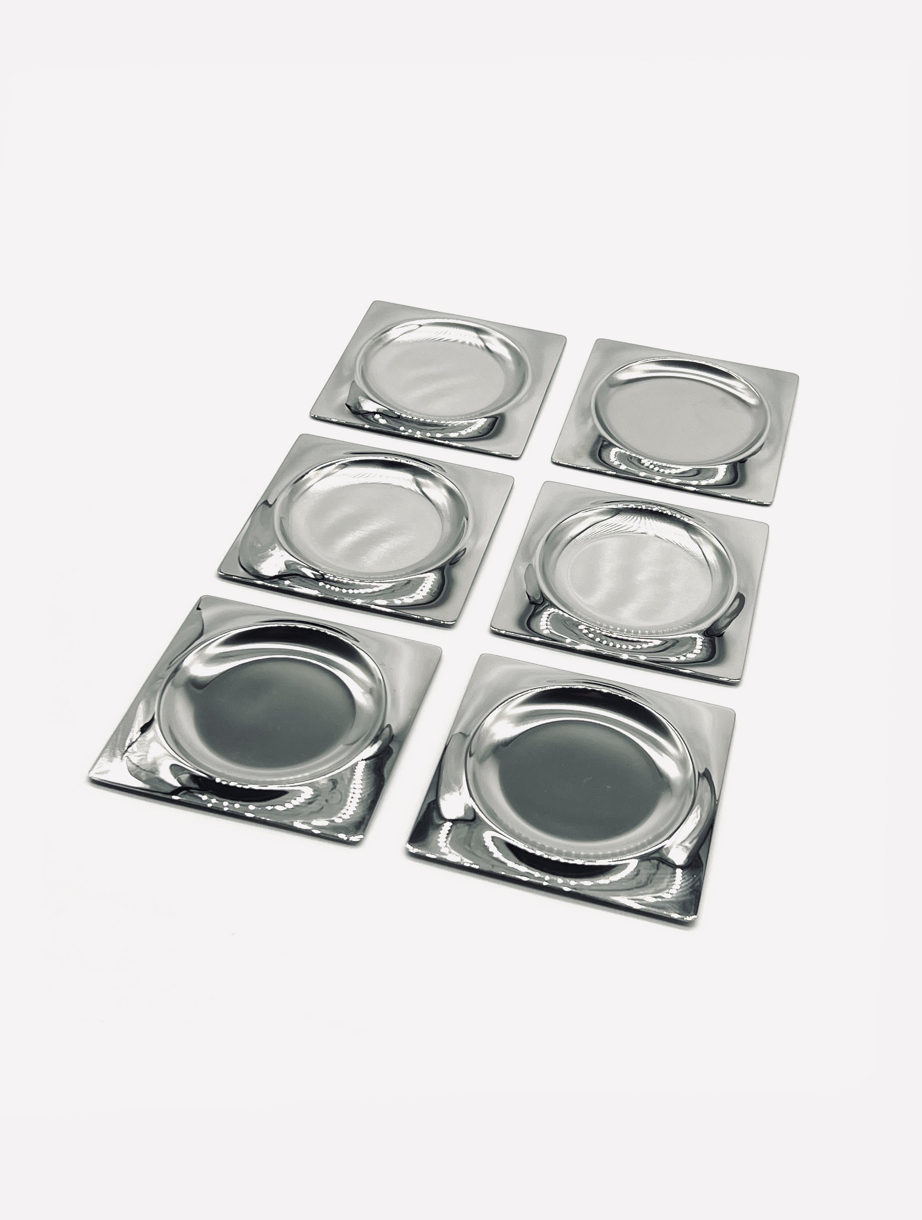 Set of six vintage stainless steel coasters with square design