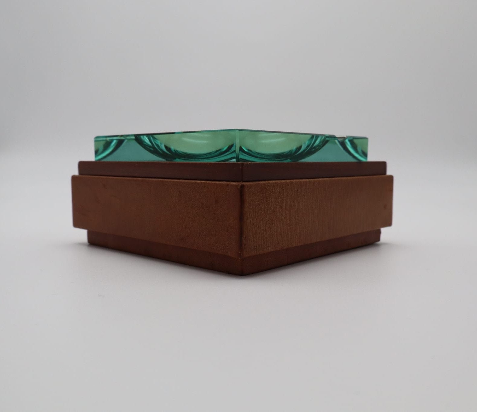 Fontana Arte Nile-Green Crystal Ashtray with Hidden Compartment (c. 1960s–70s) — angled view highlighting green crystal and w