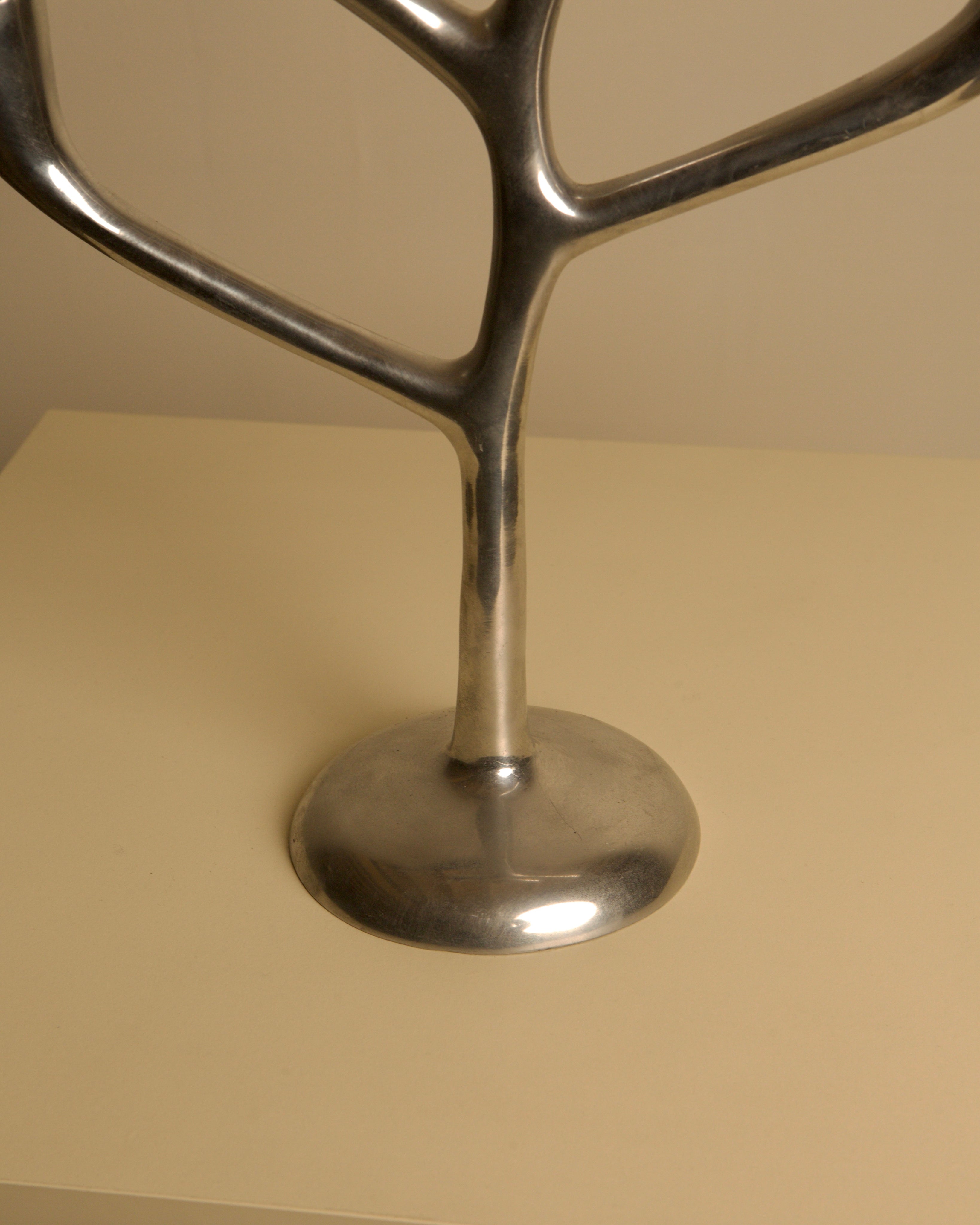 Large 80's Aluminum "Tree" Candleholder — angled view on light-colored surface