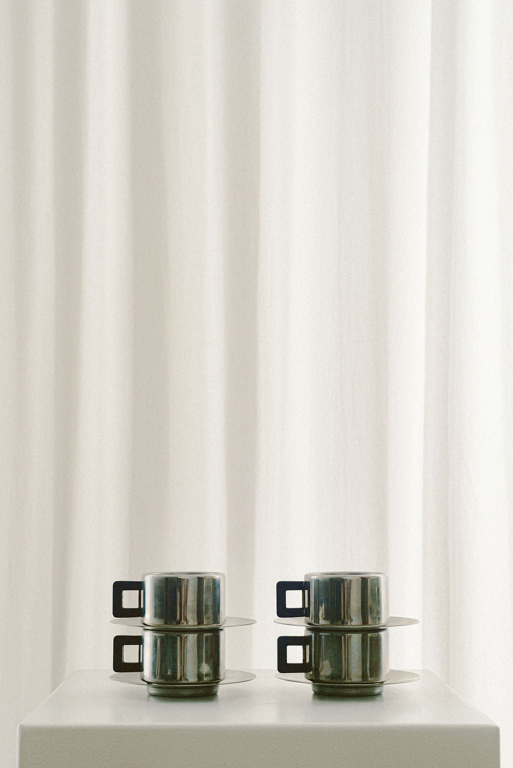 Casalinghi STO Stainless Steel Espresso Cups — front view on white pedestal