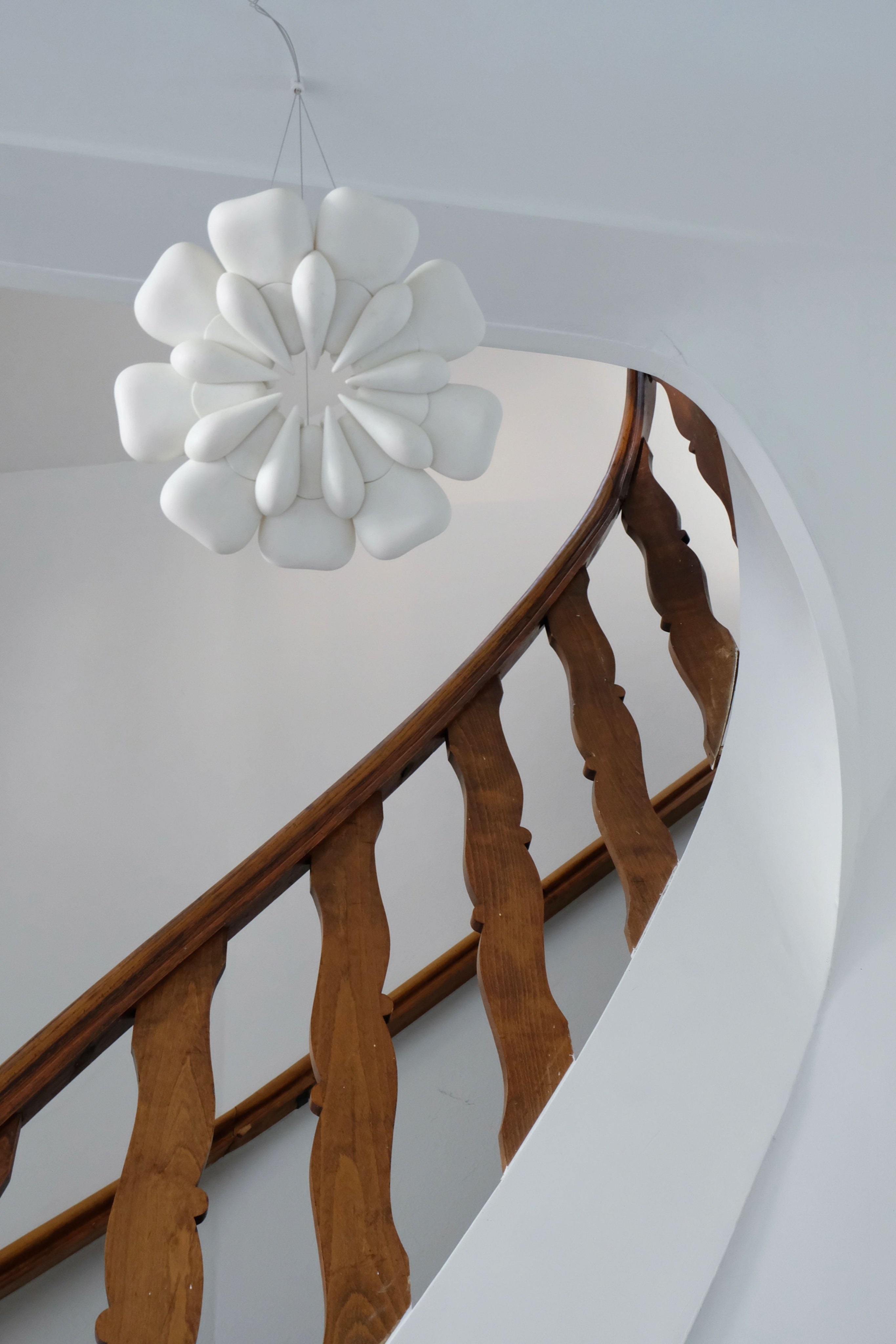 Pelagi' Pendant Light — hanging above wooden staircase in modern interior