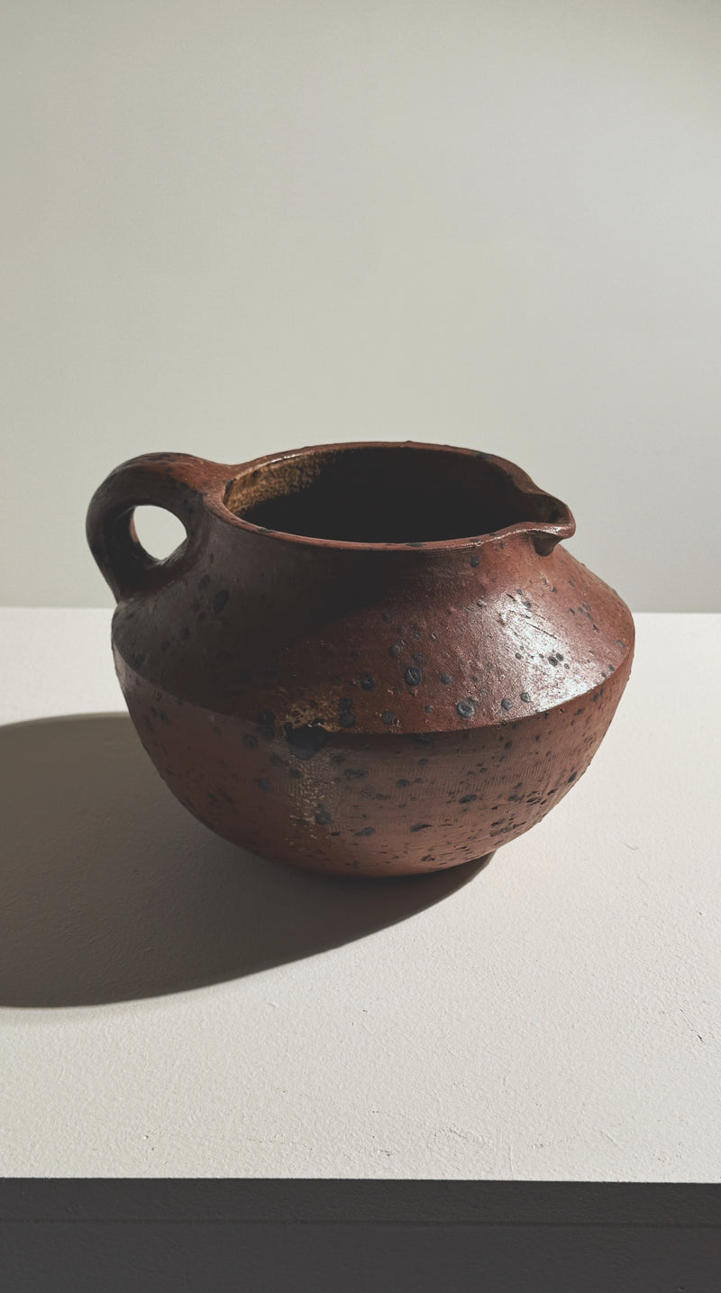 Side profile view of Pierre Digan sculptural stoneware pitcher 1965