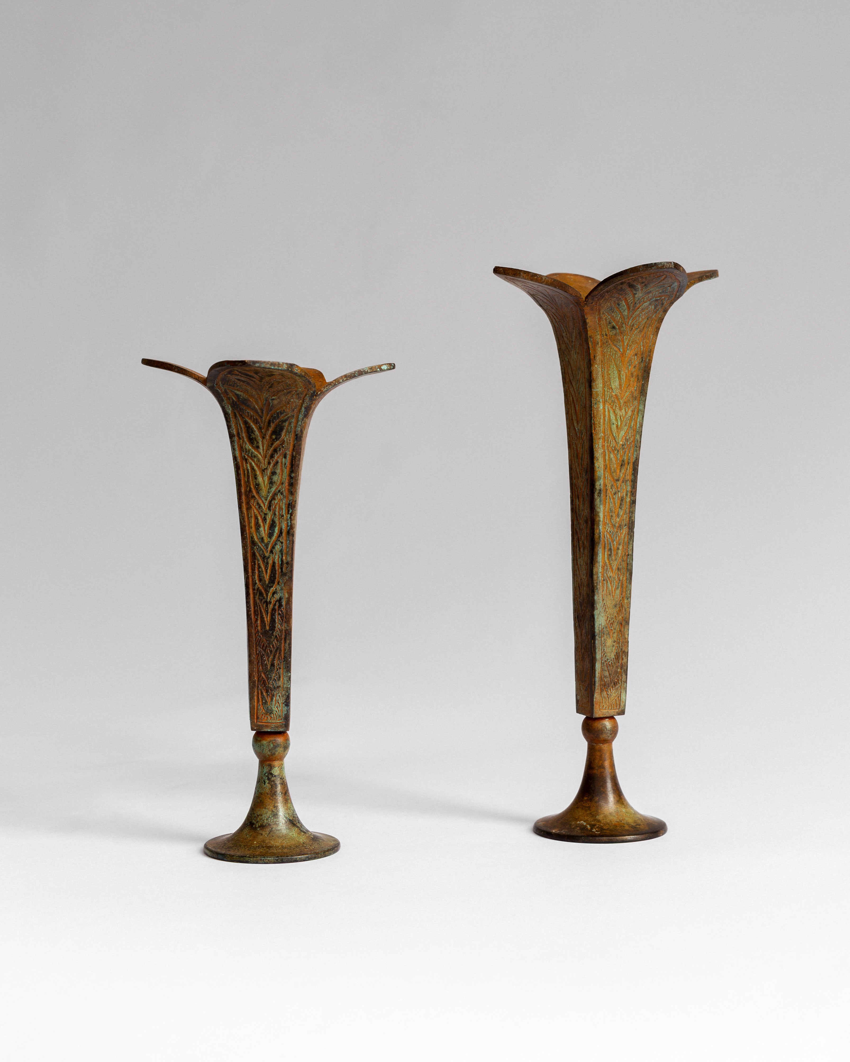 Pair of Sculptural Bronze Candlesticks/Vases with Patina — lifestyle setting