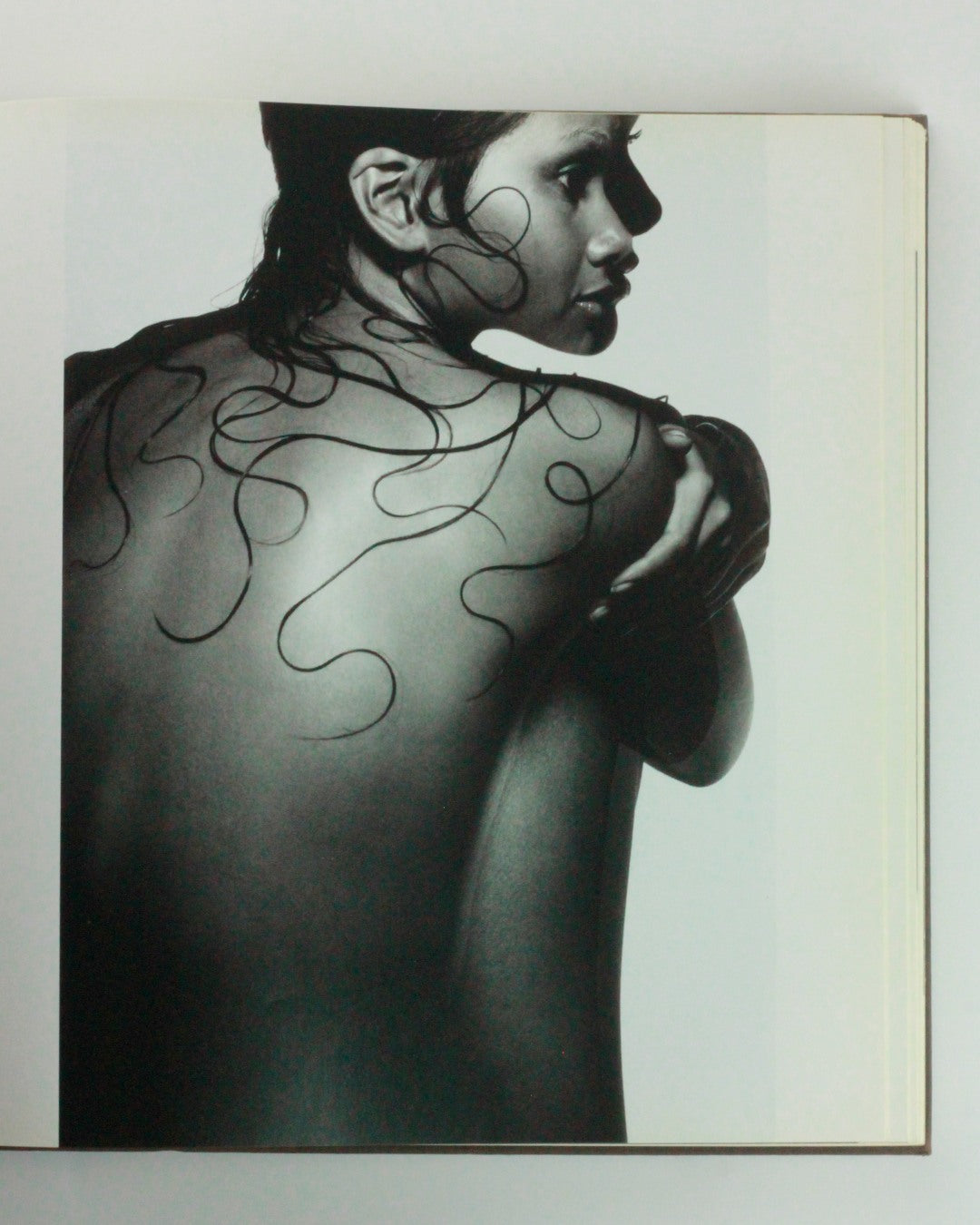 Appearances — black and white back view with flowing lines