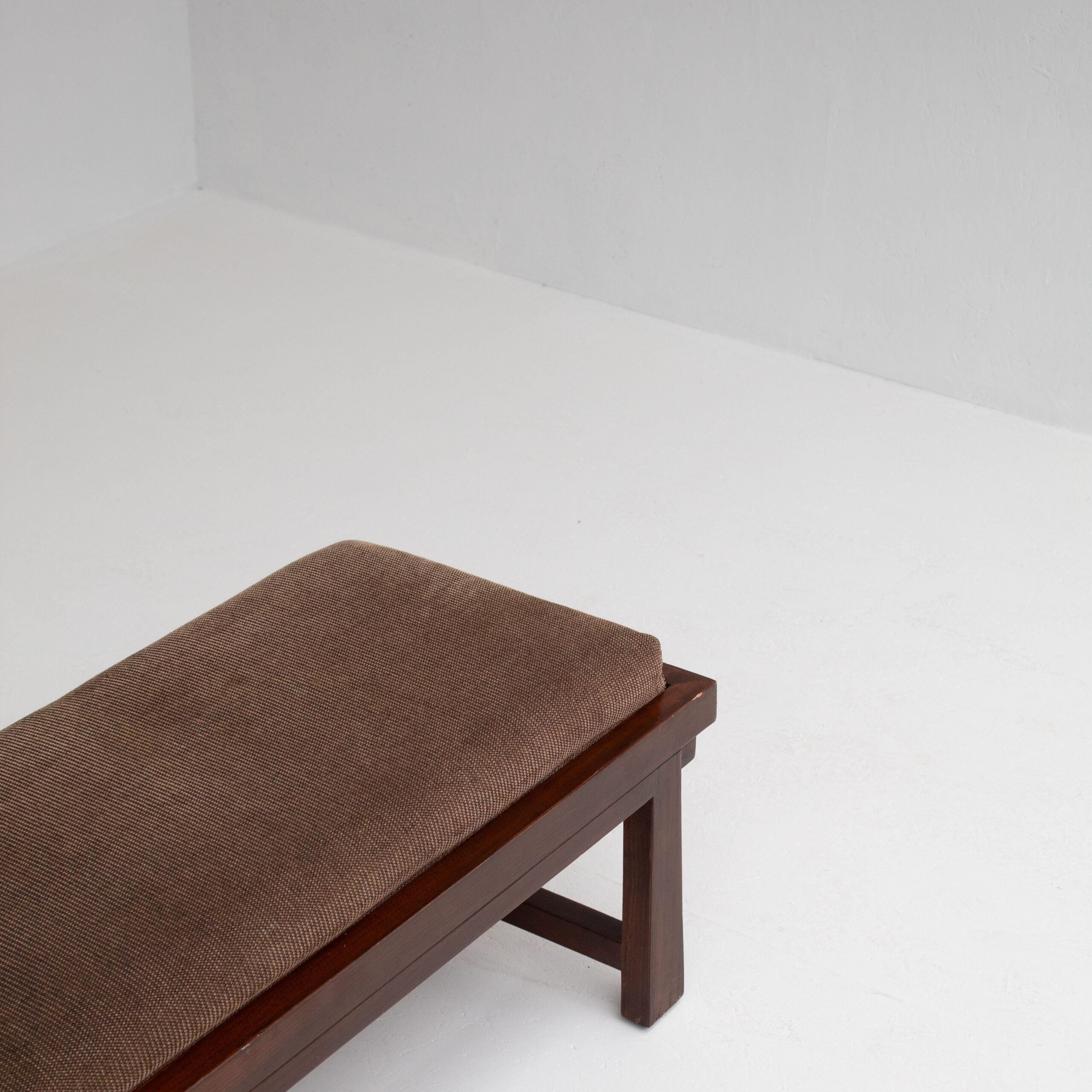 Rustique Bench in Wood with Cushion — angled view showing brown fabric cushion