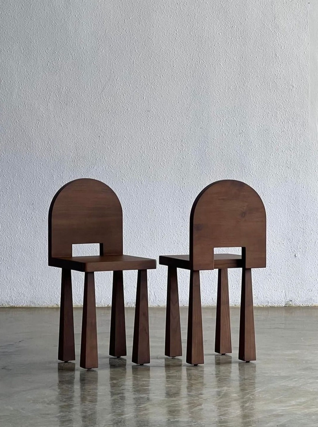 Luna Chair II — side angle showing dark wood finish and minimalist design