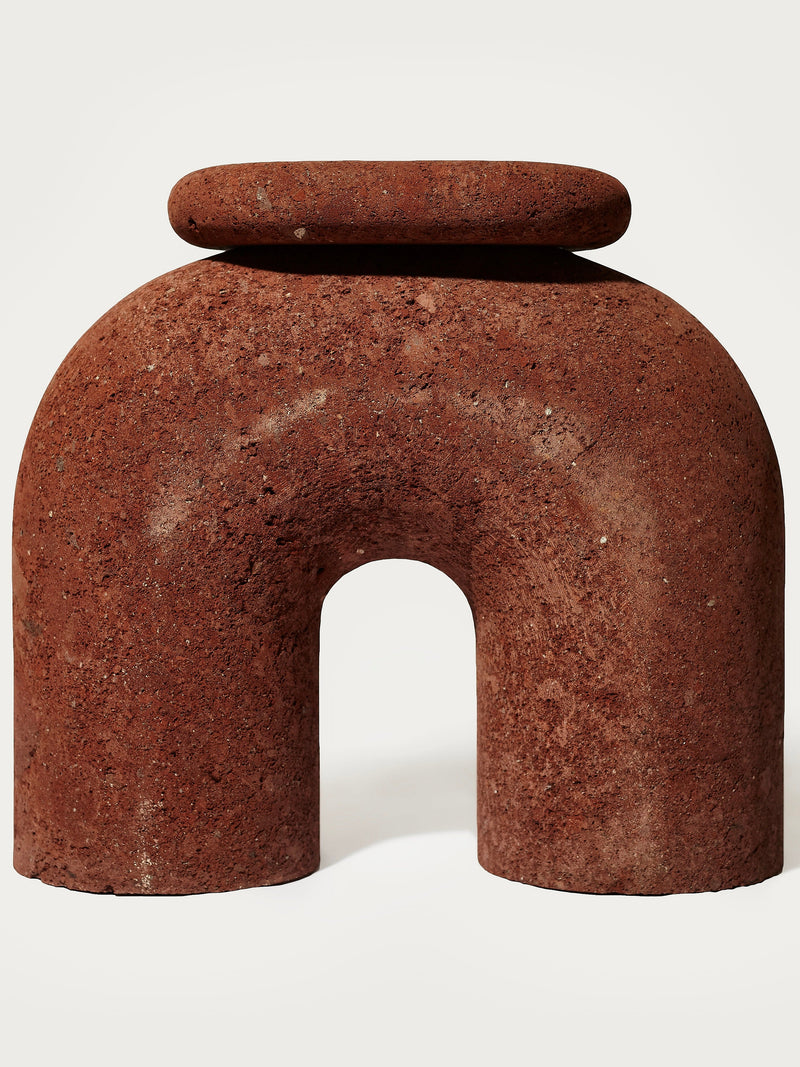 Neolithic' Stool — close-up of textured red stone material