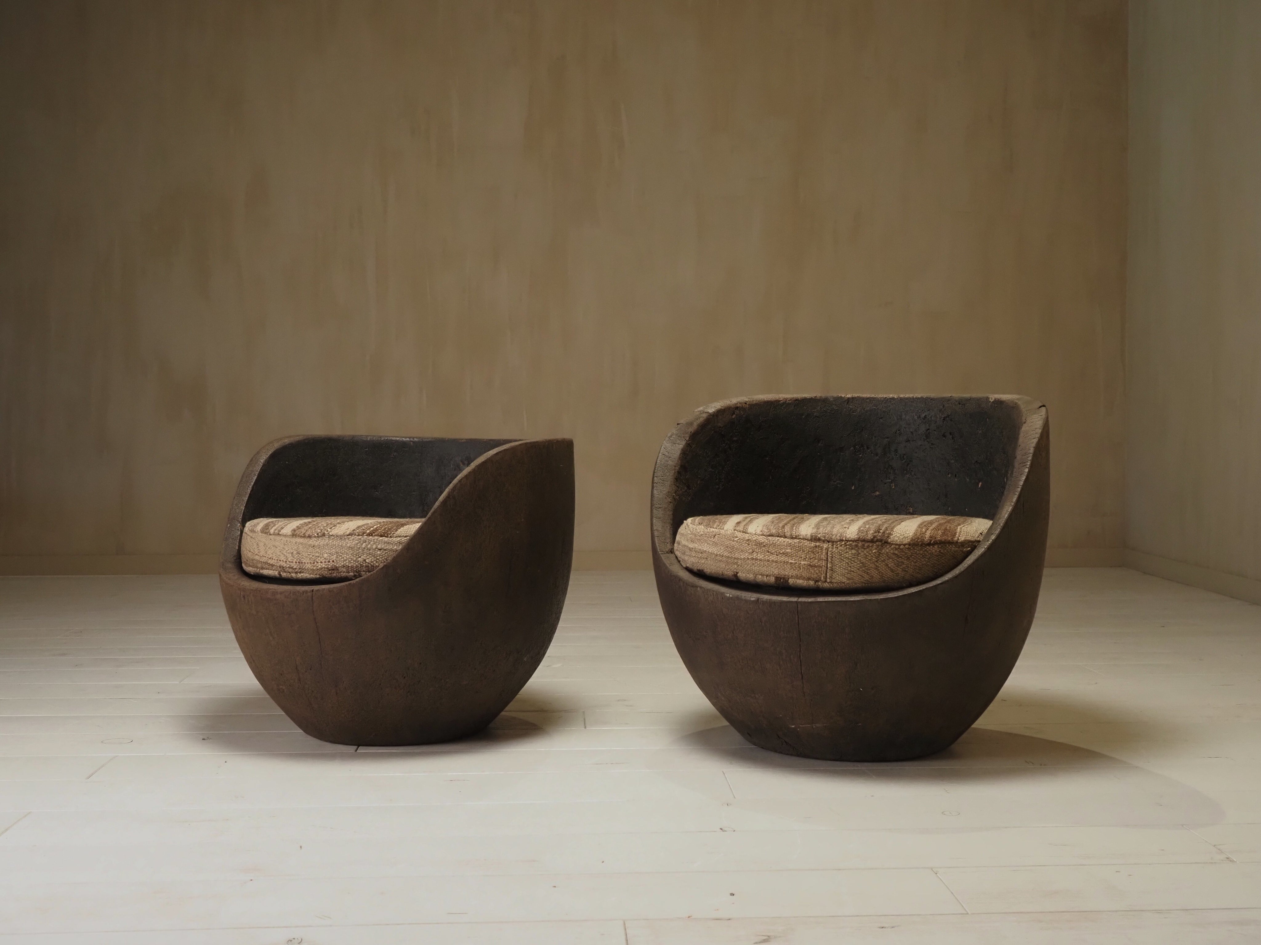 Sculptural mid-century hand-carved pair lounge chairs — close-up