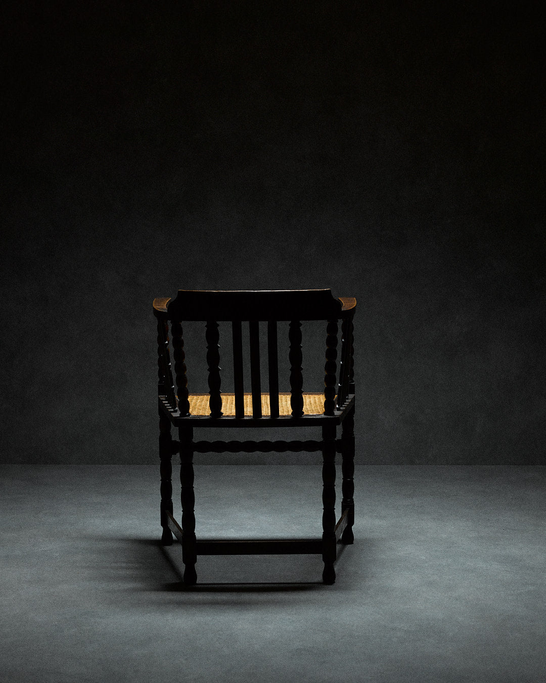 Captains Chair with Cane Seating — top view of black wooden frame