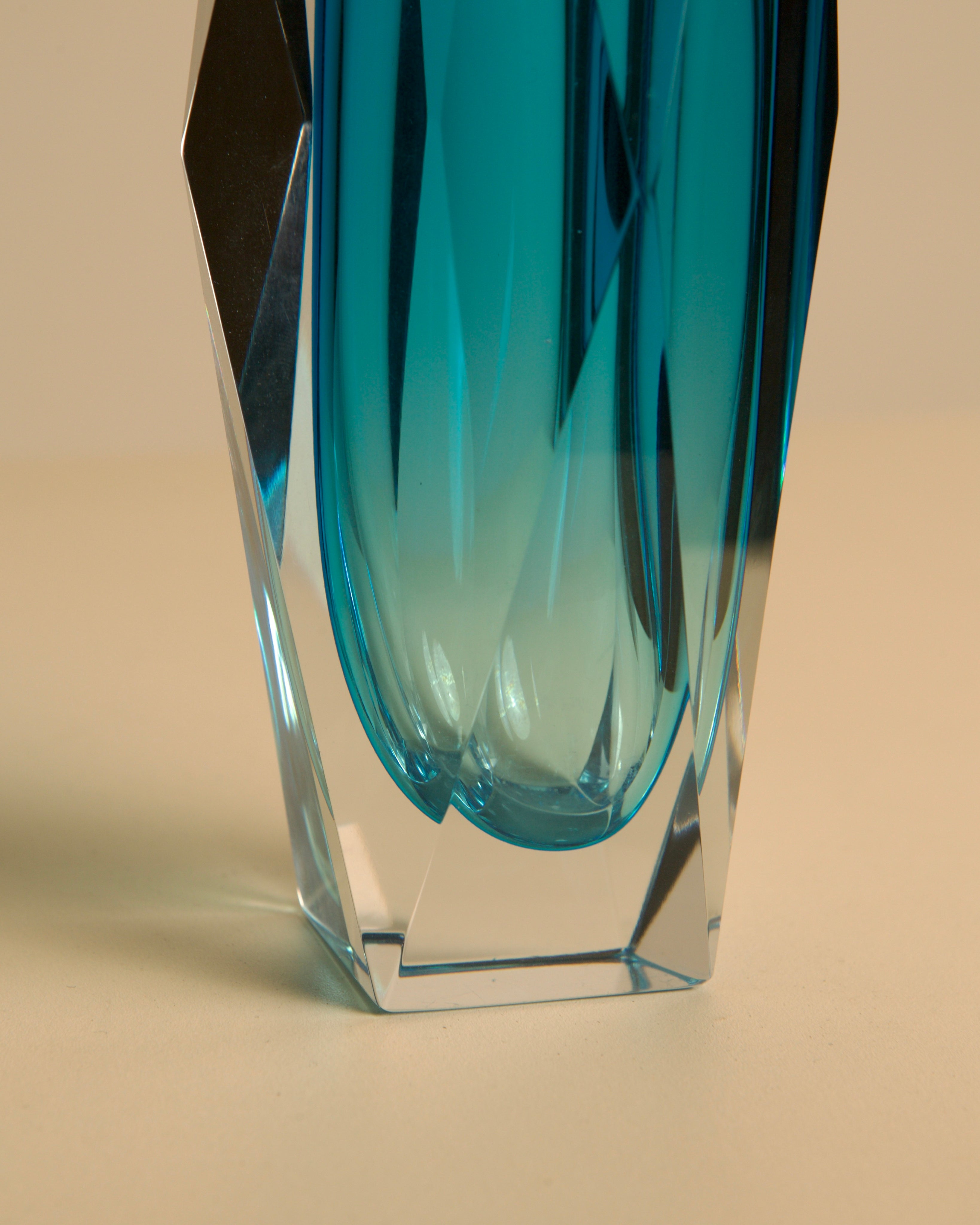 Close-up detail of turquoise Murano glass Diamant vase base