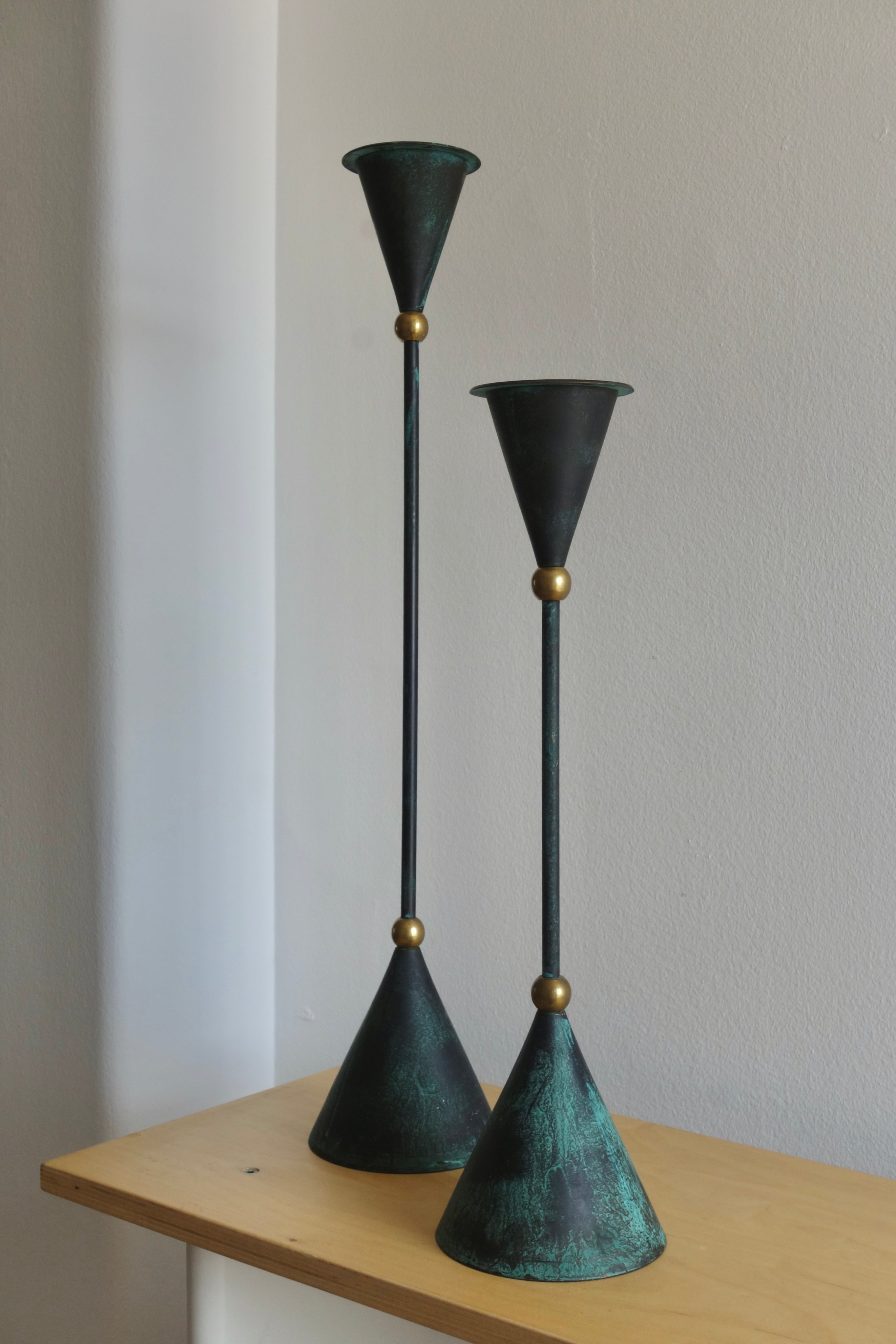 Oversized Memphis style sculptural metal and brass candleholders, 1980s — lifestyle setting