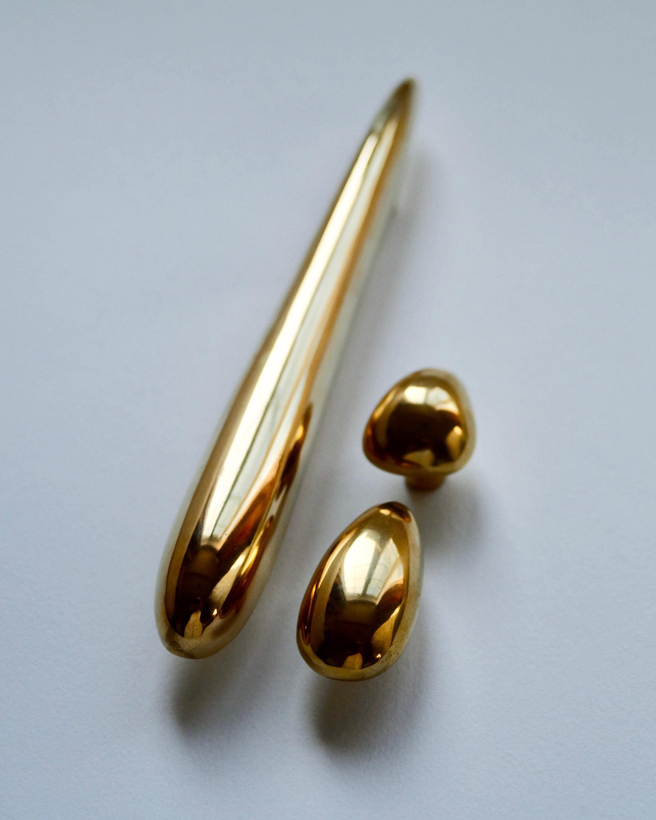 MOMI Cabinet/Appliance Pull Long — gold finish on white background