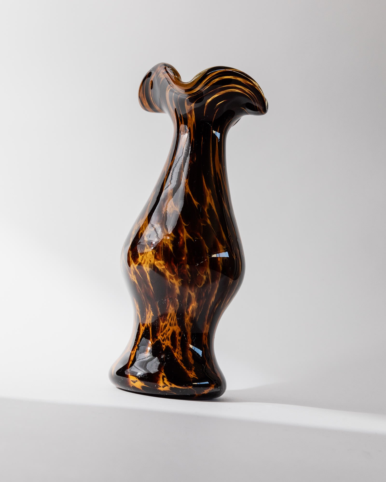 Amber Murano glass vase with ruffled rim, side profile view