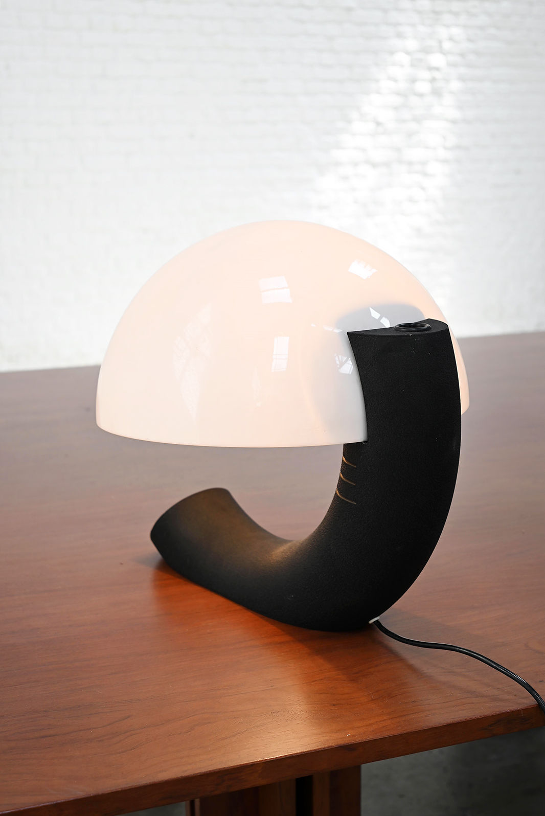Italian Concordia table lamp with curved black base and dome shade