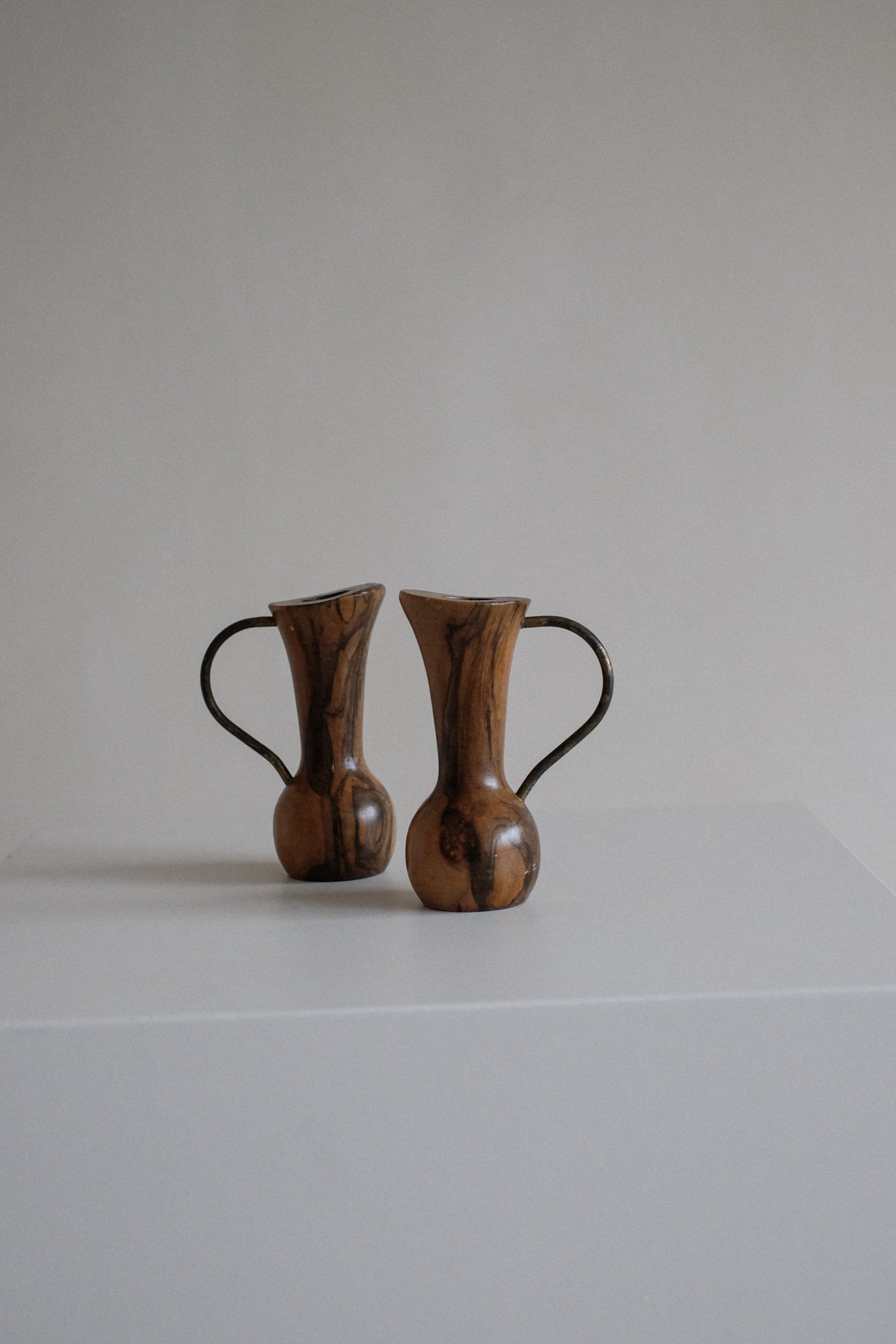 Pair of Wooden Candle Holders — front view on white pedestal