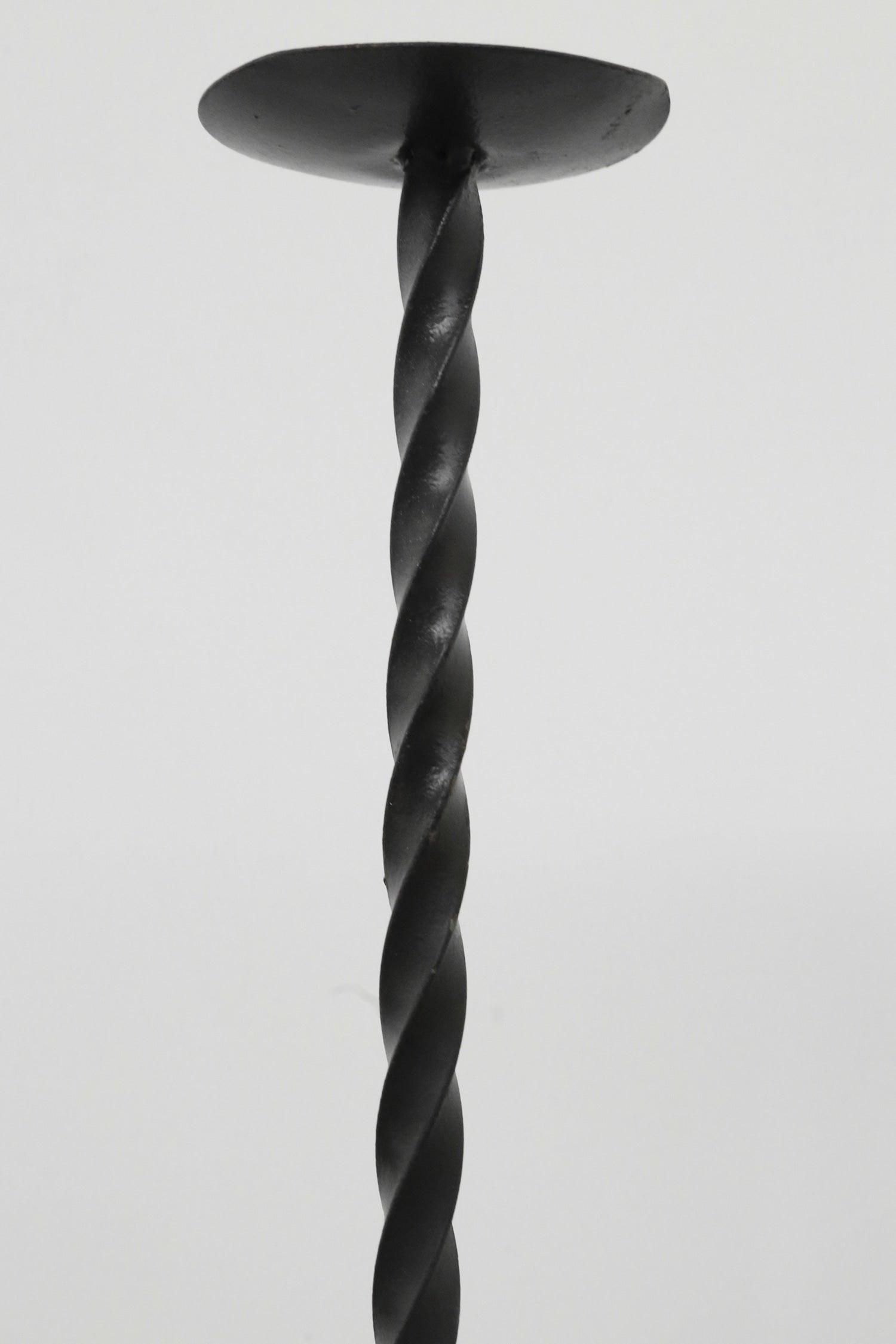 Twisted Iron Floor Candleholder Set — close-up of twisted black iron design