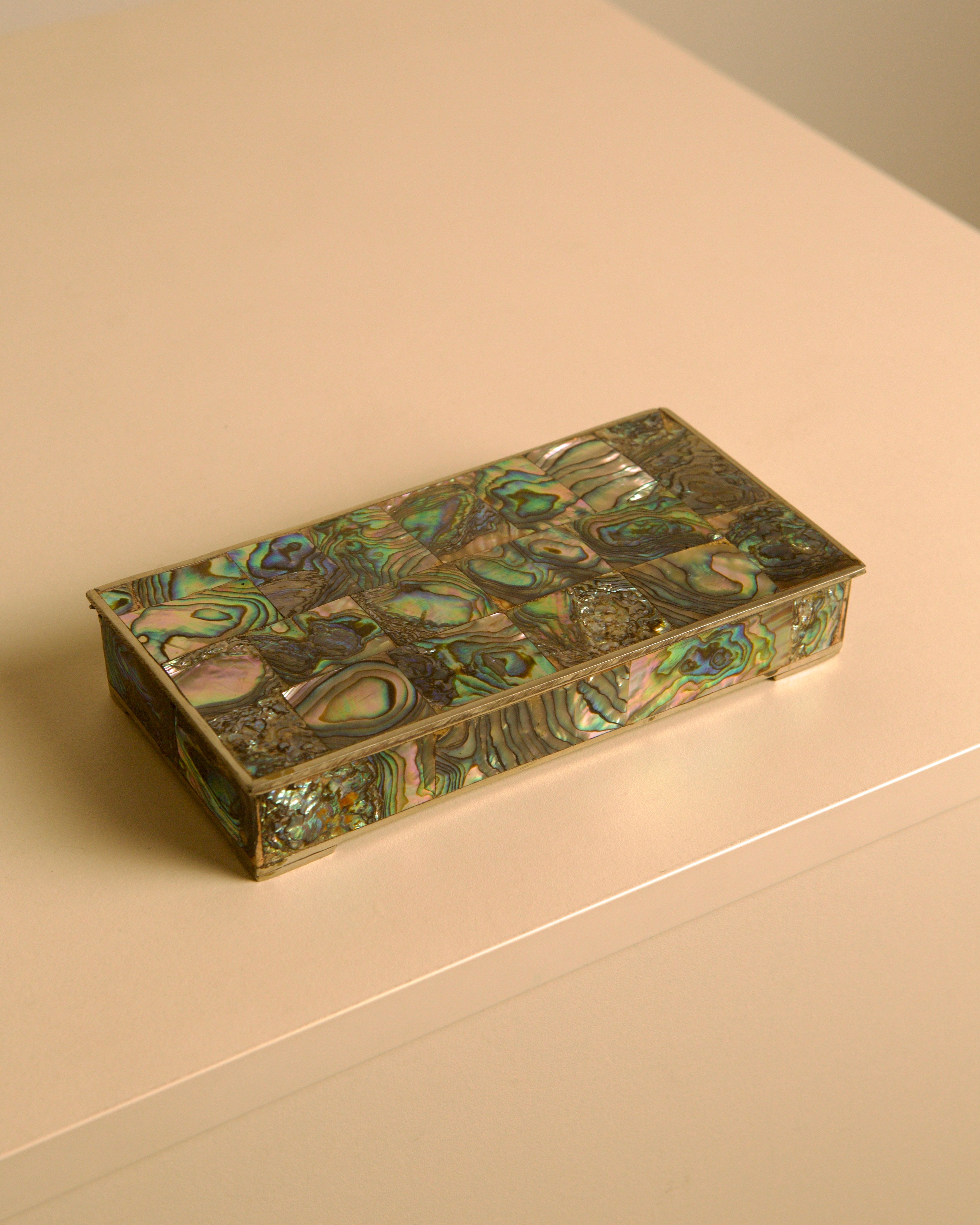 Italian Rectangular Silver and Mother-of-pearl Inlaid Box 40s — angled view on light surface