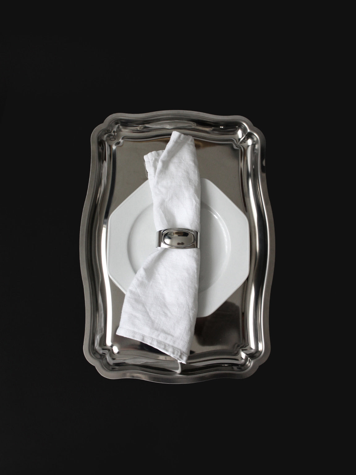 Stainless Steel WMF Napkin Rings, Germany, 1970s — top view on silver tray with napkin