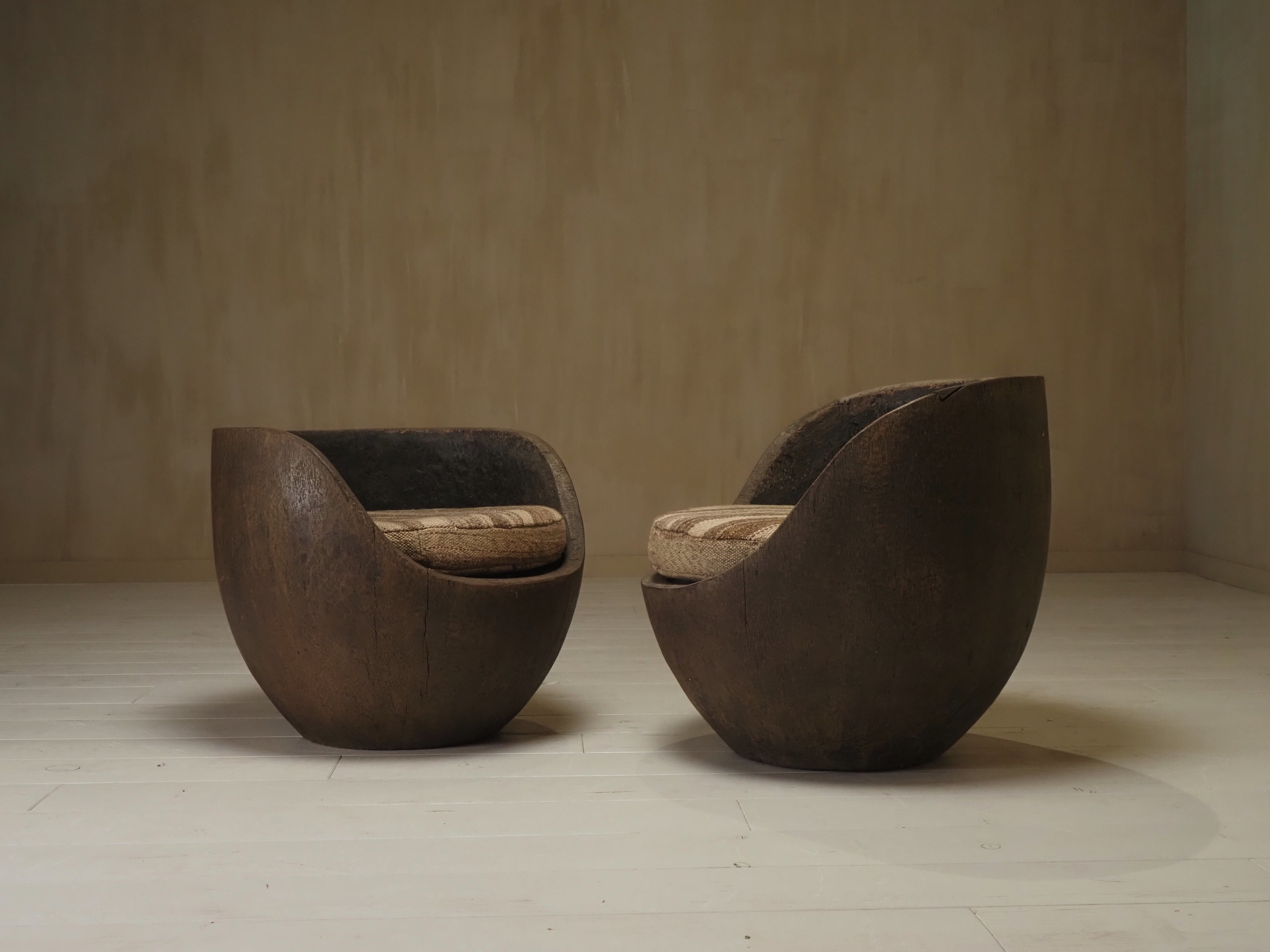 Sculptural mid-century hand-carved pair lounge chairs — in context