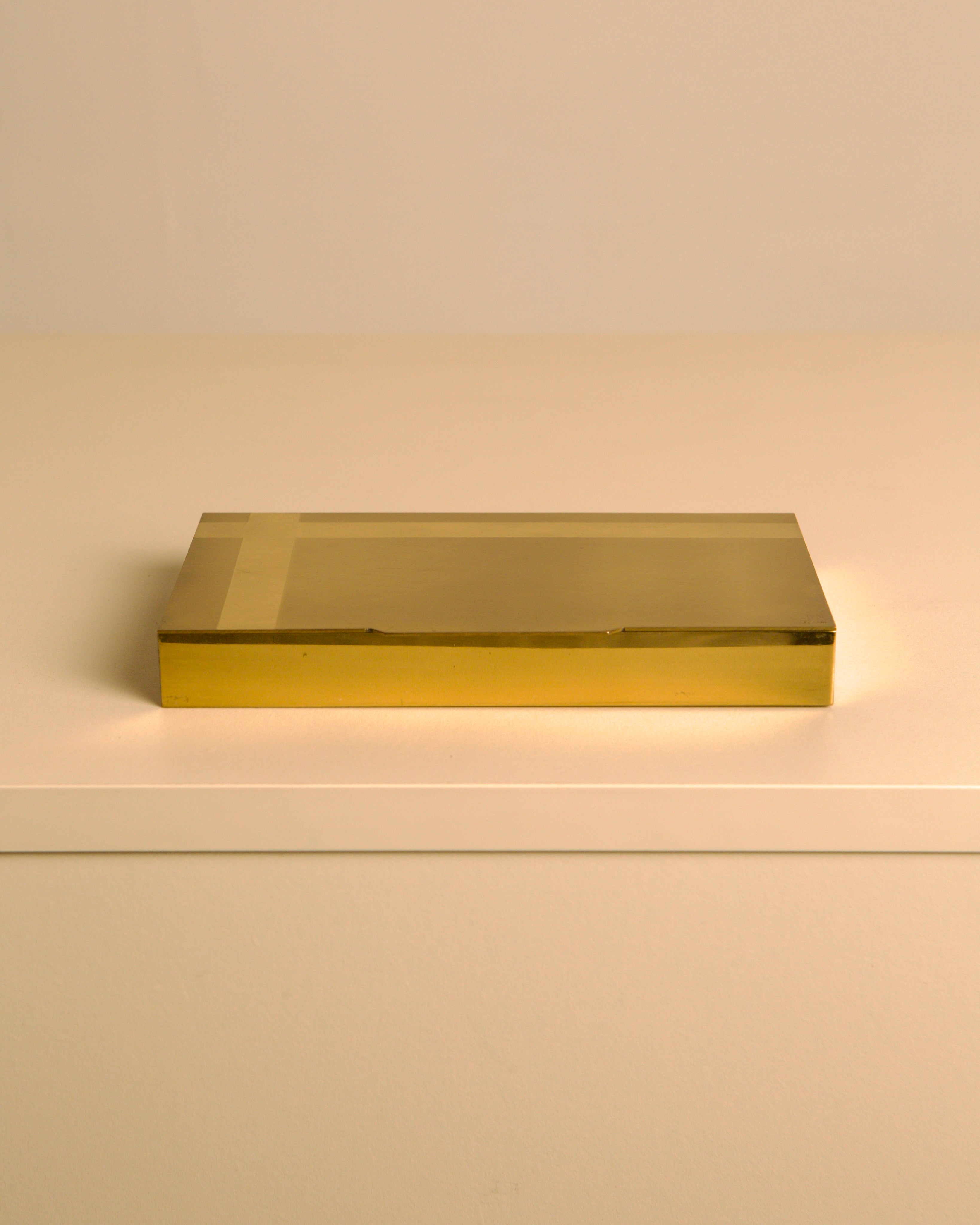 Italian 60s brass and wood rectangular box — top view on white surface