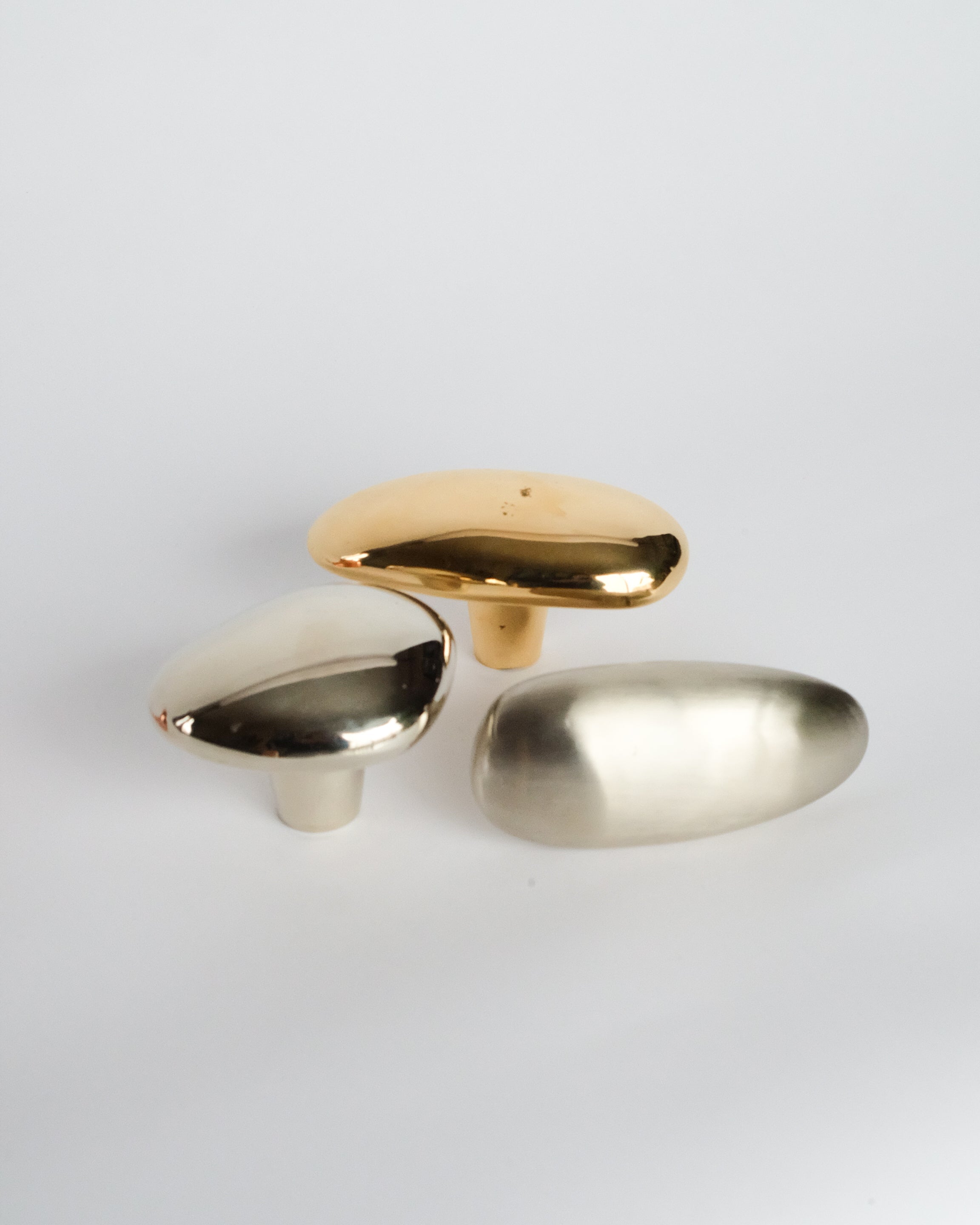 MOMI Cabinet Knob/Wall Hook Short — front view of metallic finishes